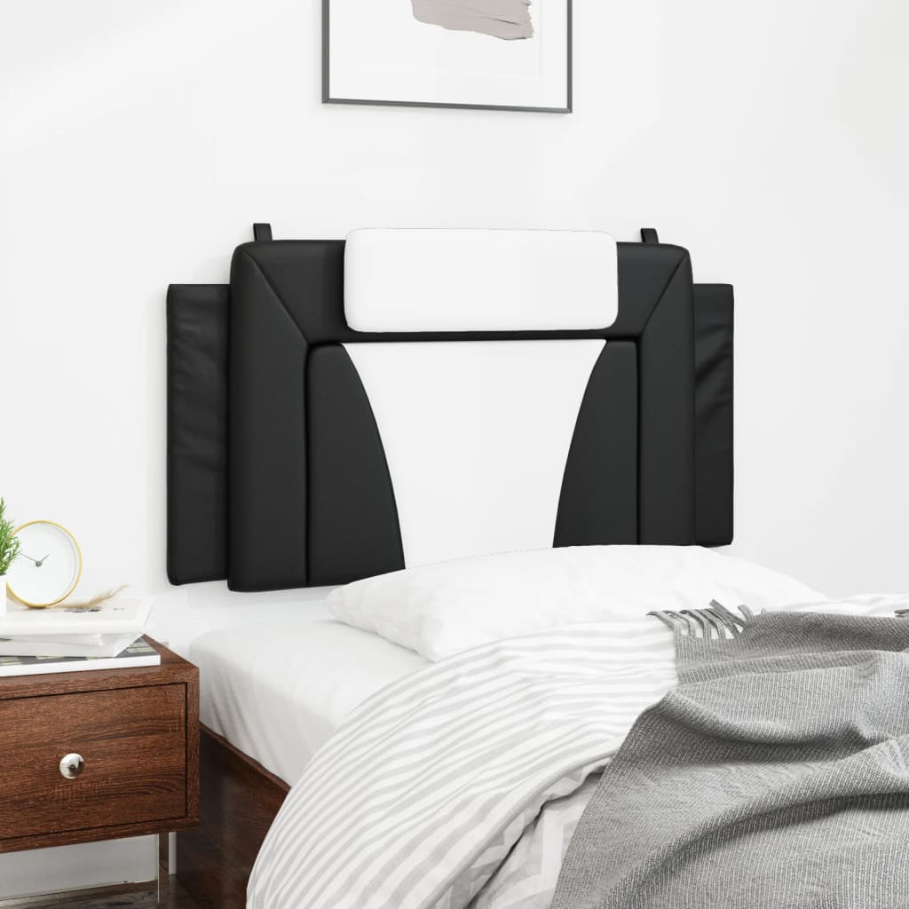 Black and white upholstered headboard with integrated white pillow