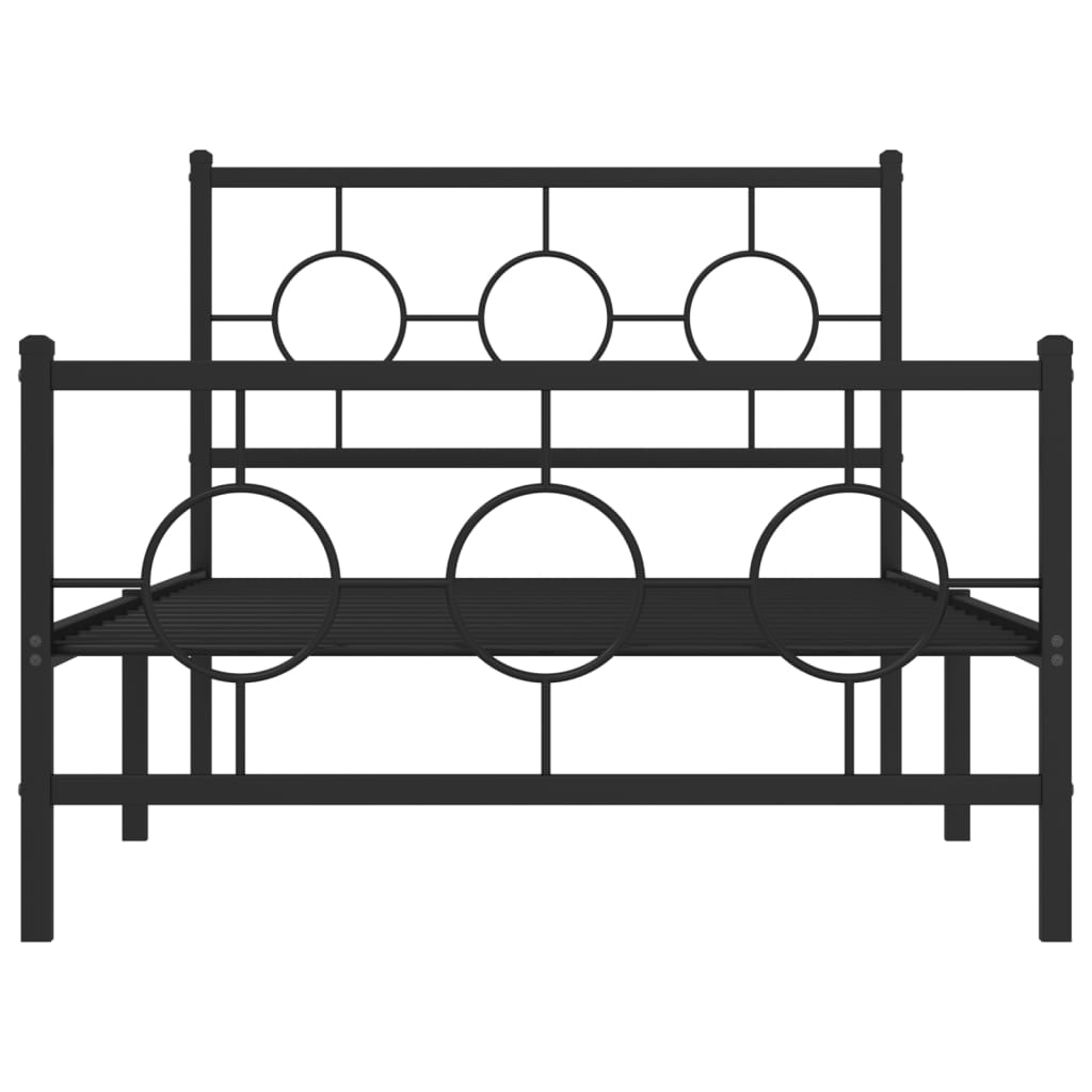 Black metal bed frame with circular accents and white mattress