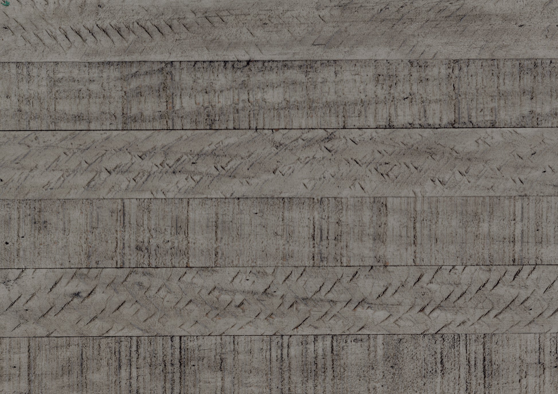 Closeup of weathered grey wood planks with textured grooves