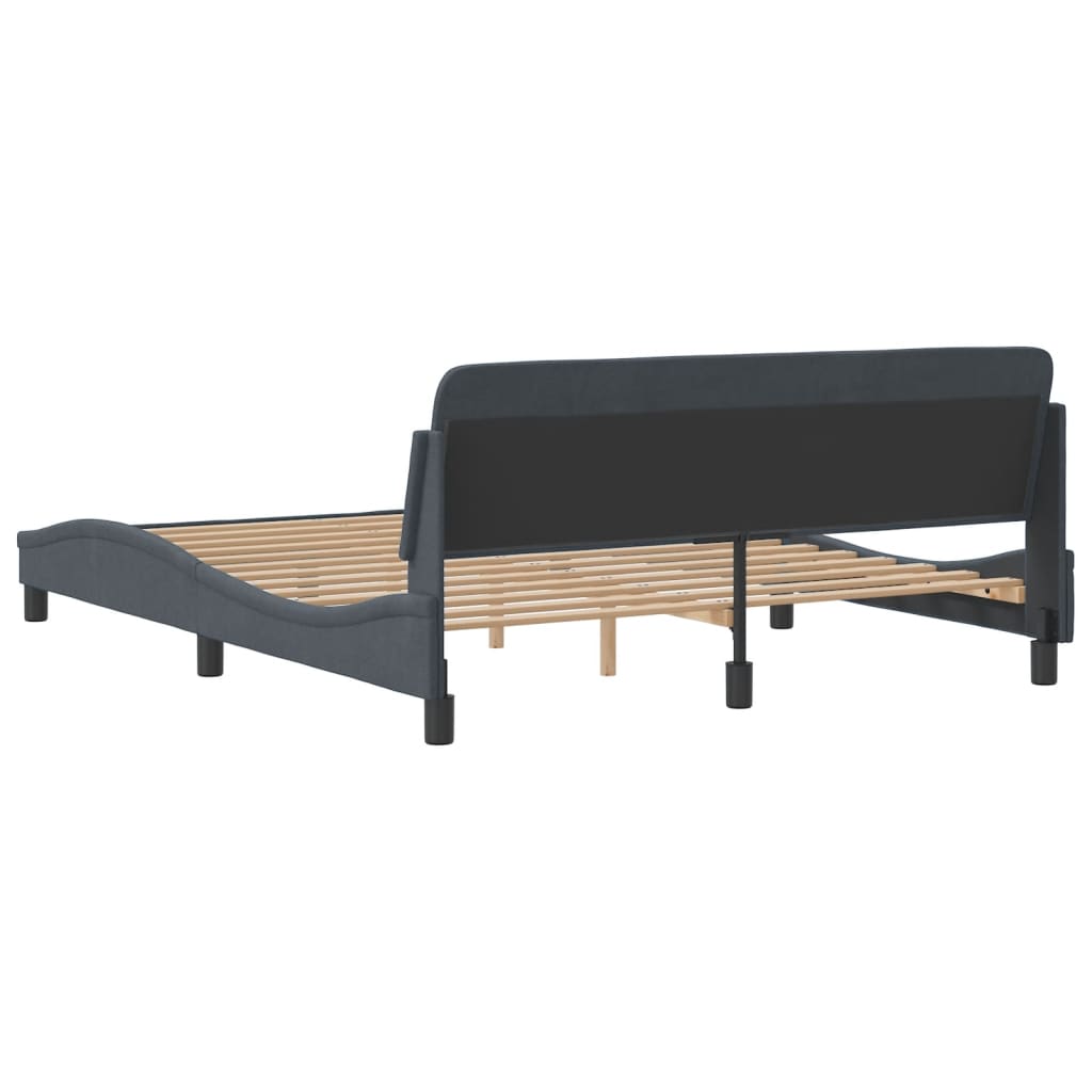 Dark grey fabric upholstered bed frame with curved design and wooden slats
