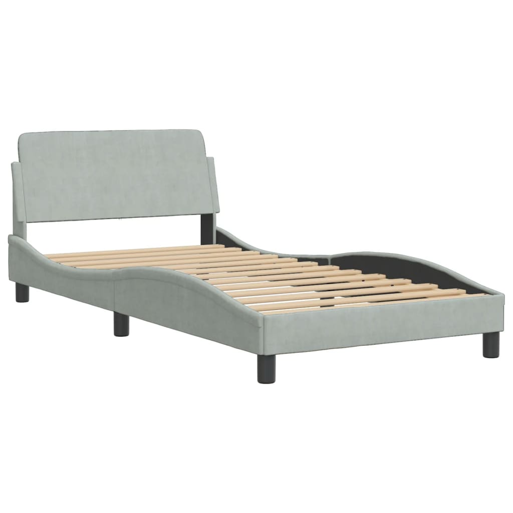 Light blue upholstered single bed frame with a curved headboard and black legs