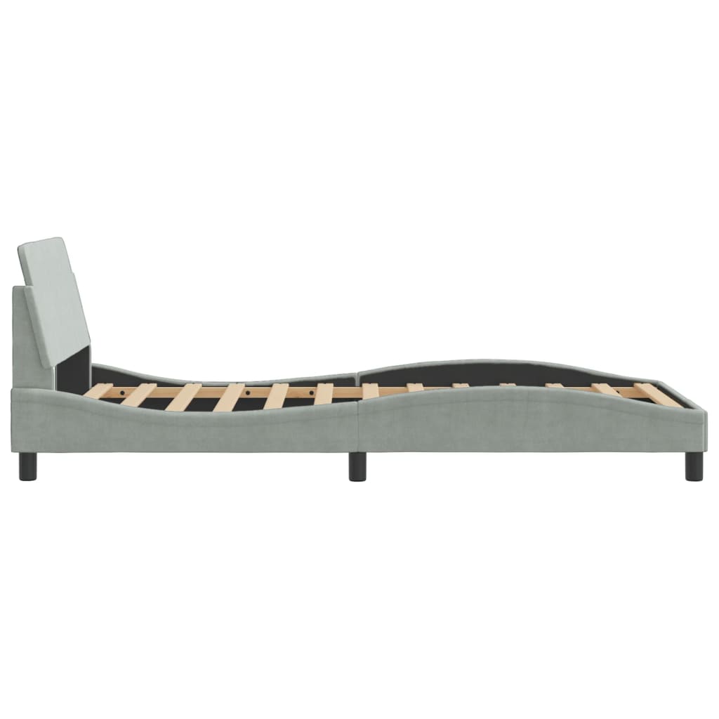 Light blue upholstered bed frame with wooden slats and black legs