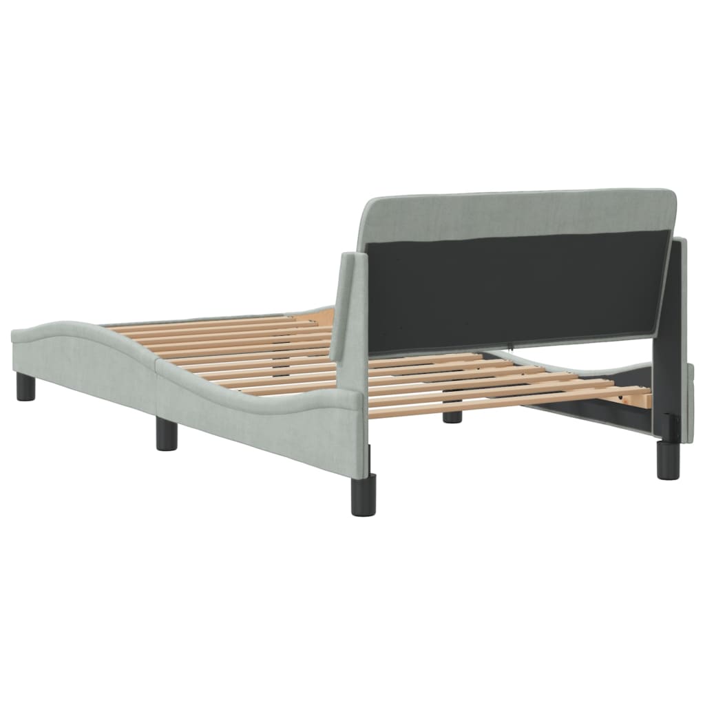 Gray upholstered bed frame with curved silhouette and wooden slats