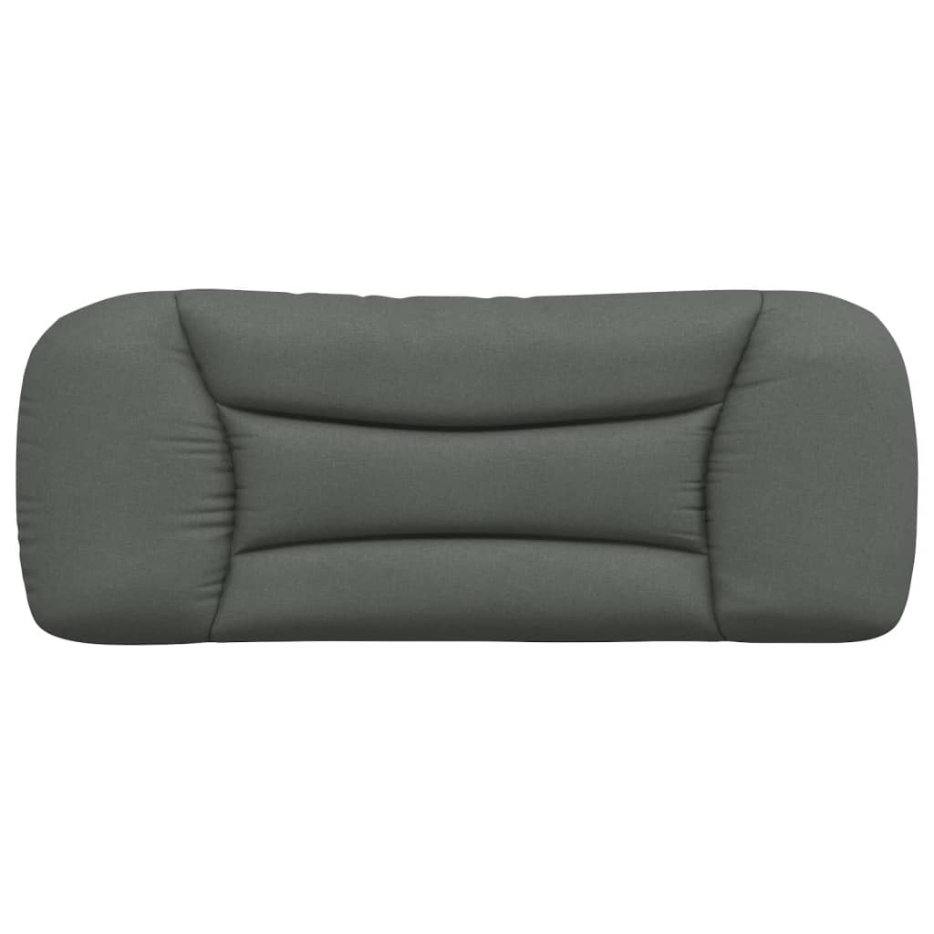 Dark grey upholstered headboard with cushioned panels mounted on a white wall