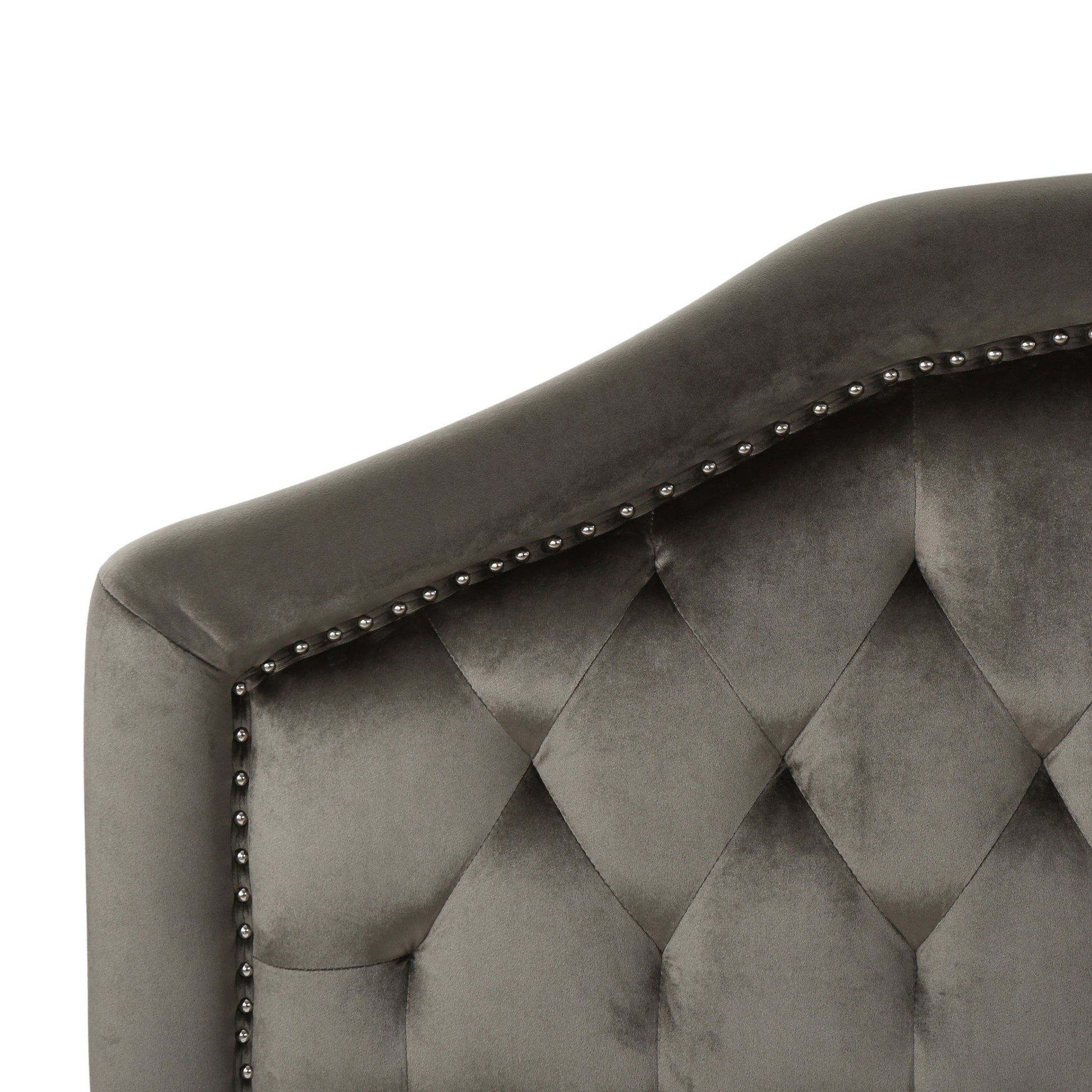 Gray velvet tufted headboard with silver nailhead trim detailing