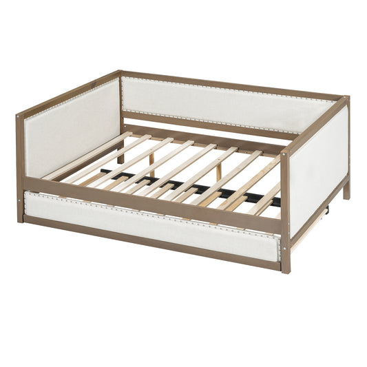 Wooden frame daybed with light beige upholstered sides and slat support