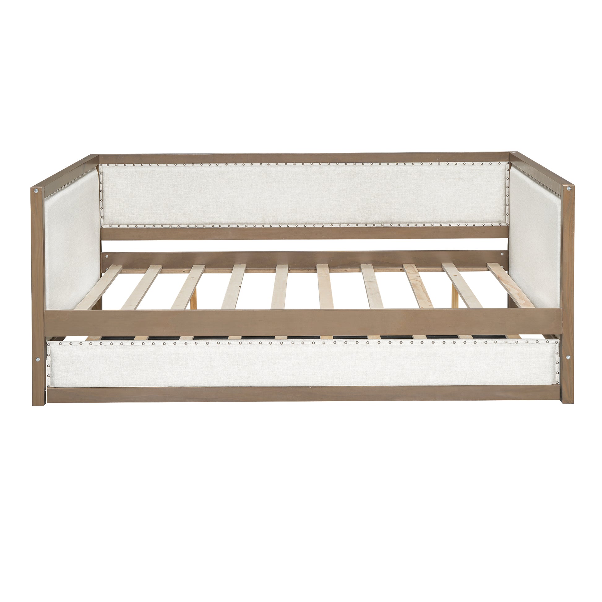 Tufted linen daybed with nailhead trim in a gray wash wood frame