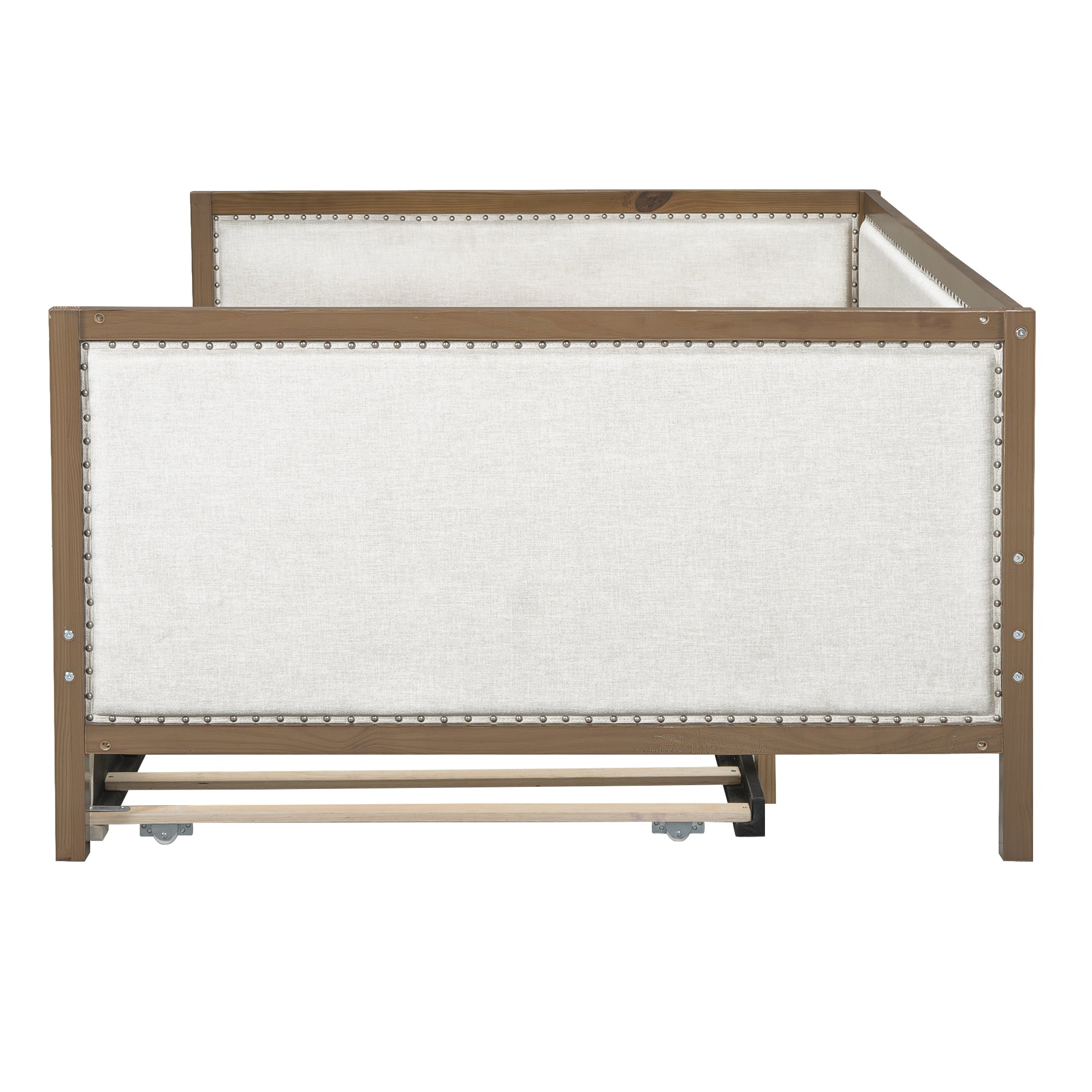 Upholstered wooden daybed with nailhead trim and light linen fabric