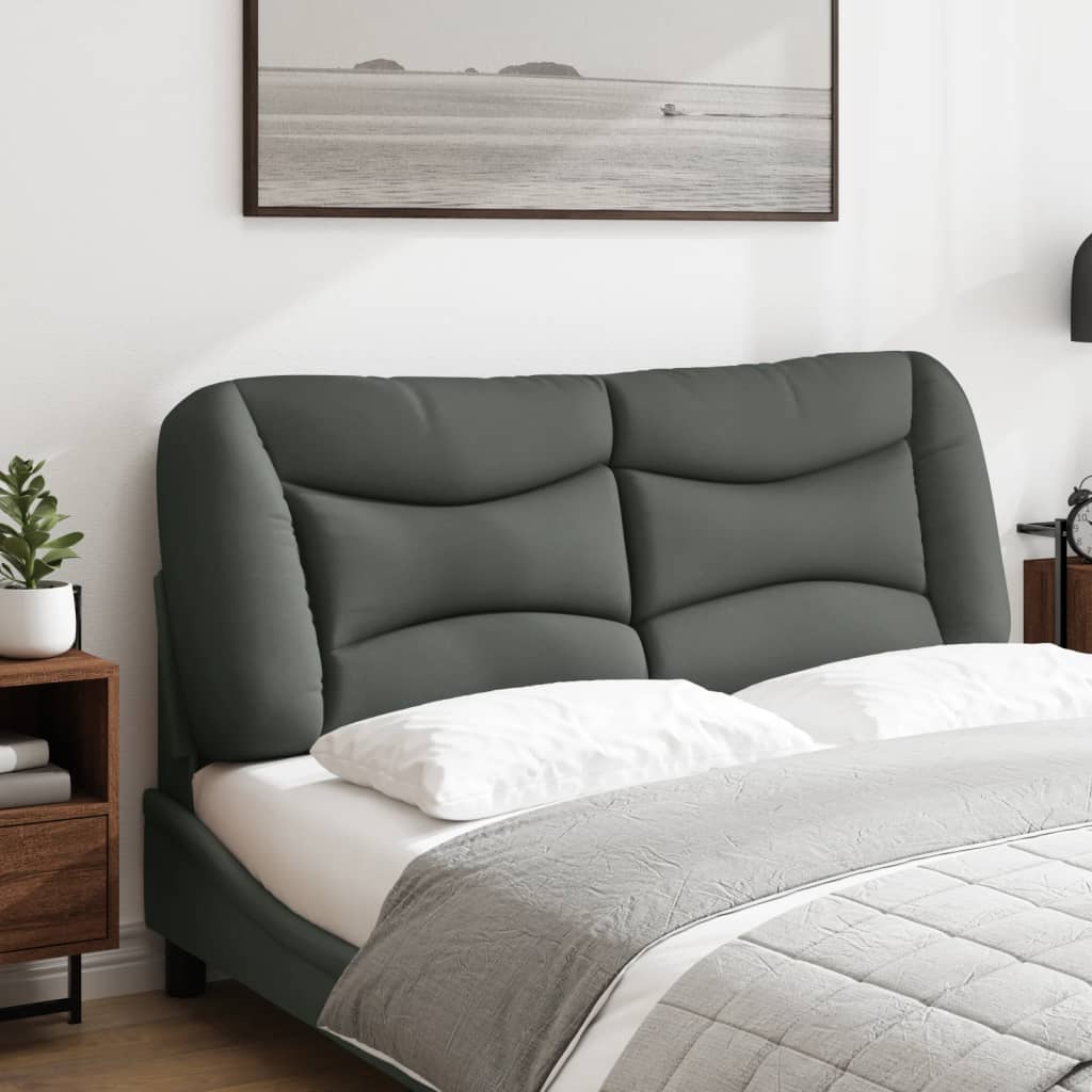Dark gray upholstered couch cushion with deep channel tufting