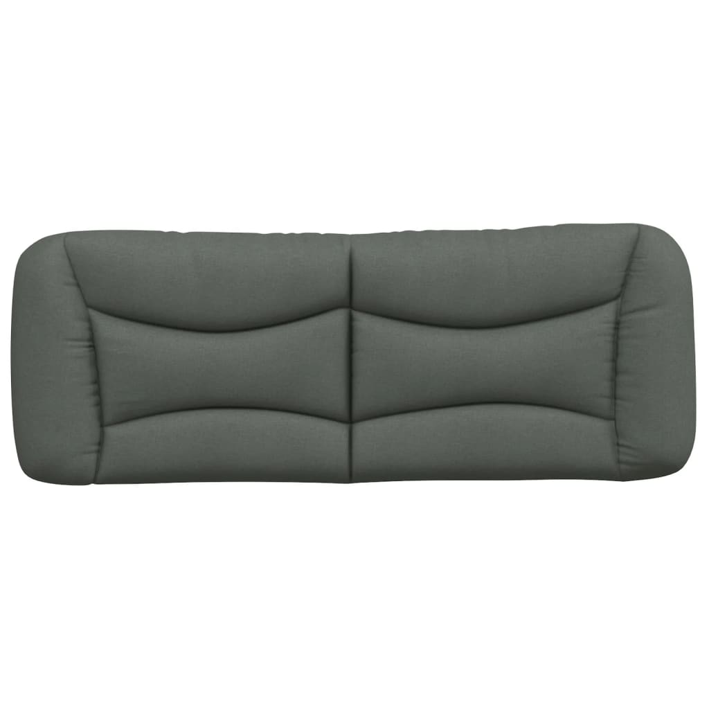 Dark gray fabric headboard with quilted panel design attached to a wall above a bed
