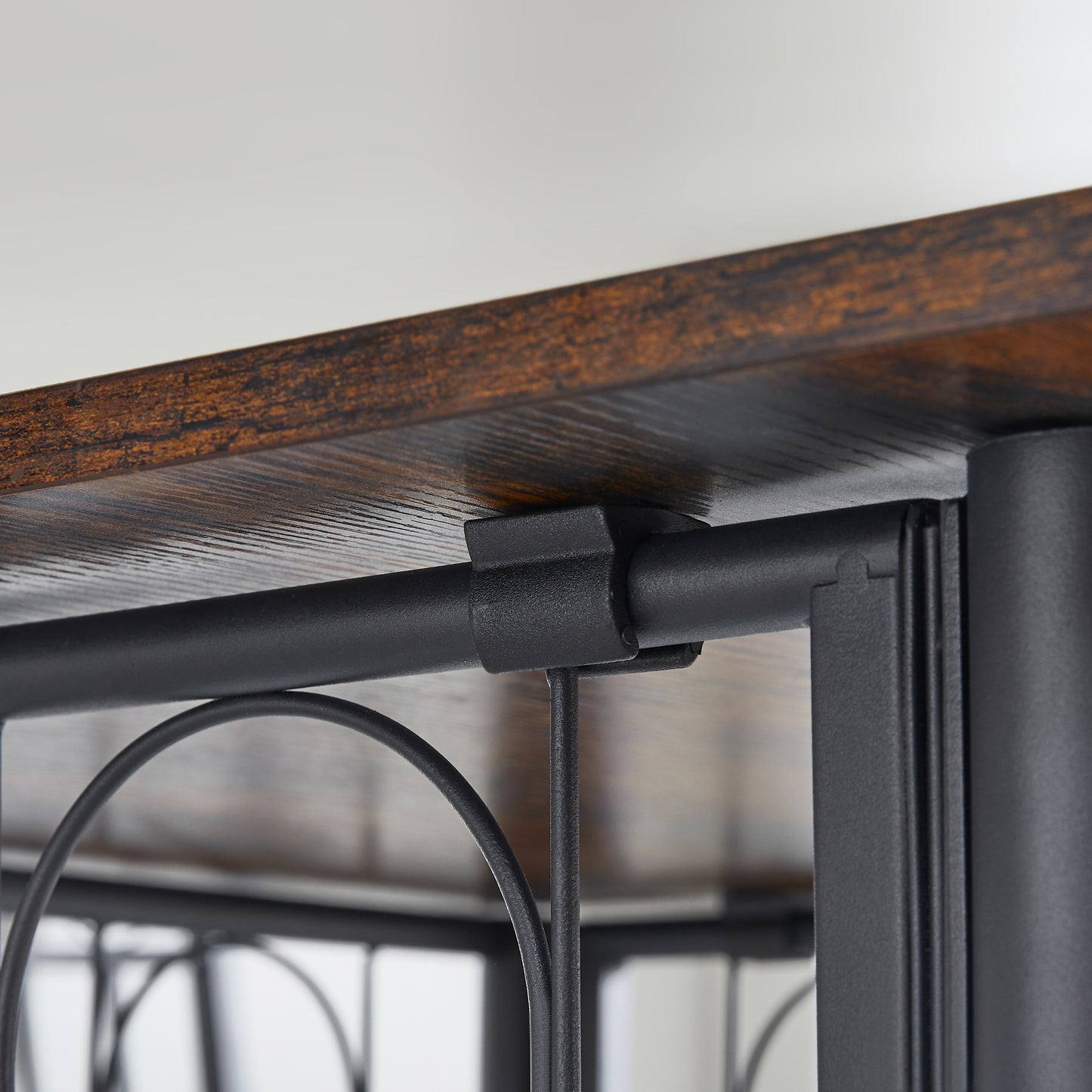 Rustic wood shelf with black metal support bracket detail