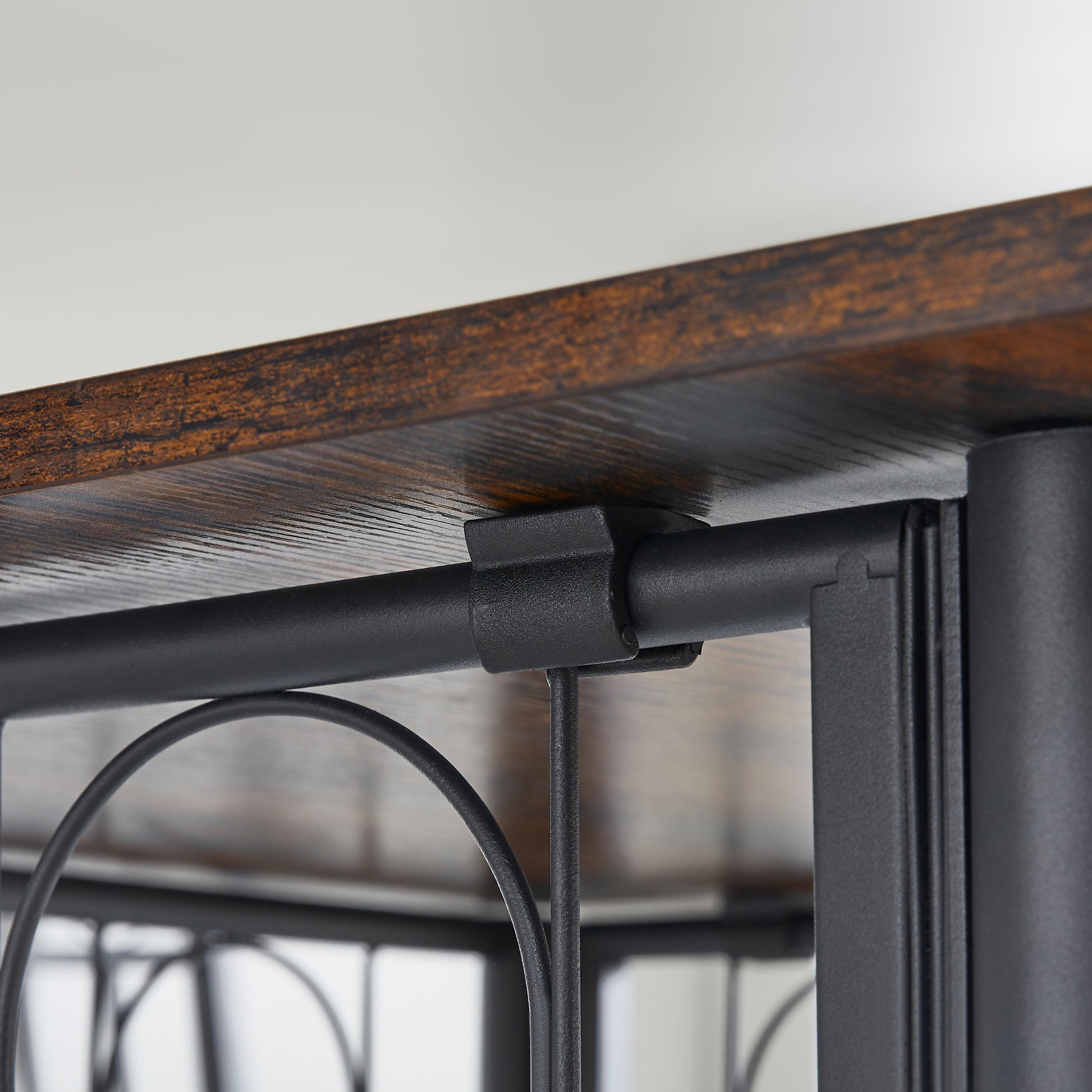 Rustic wood shelf with black metal support bracket detail