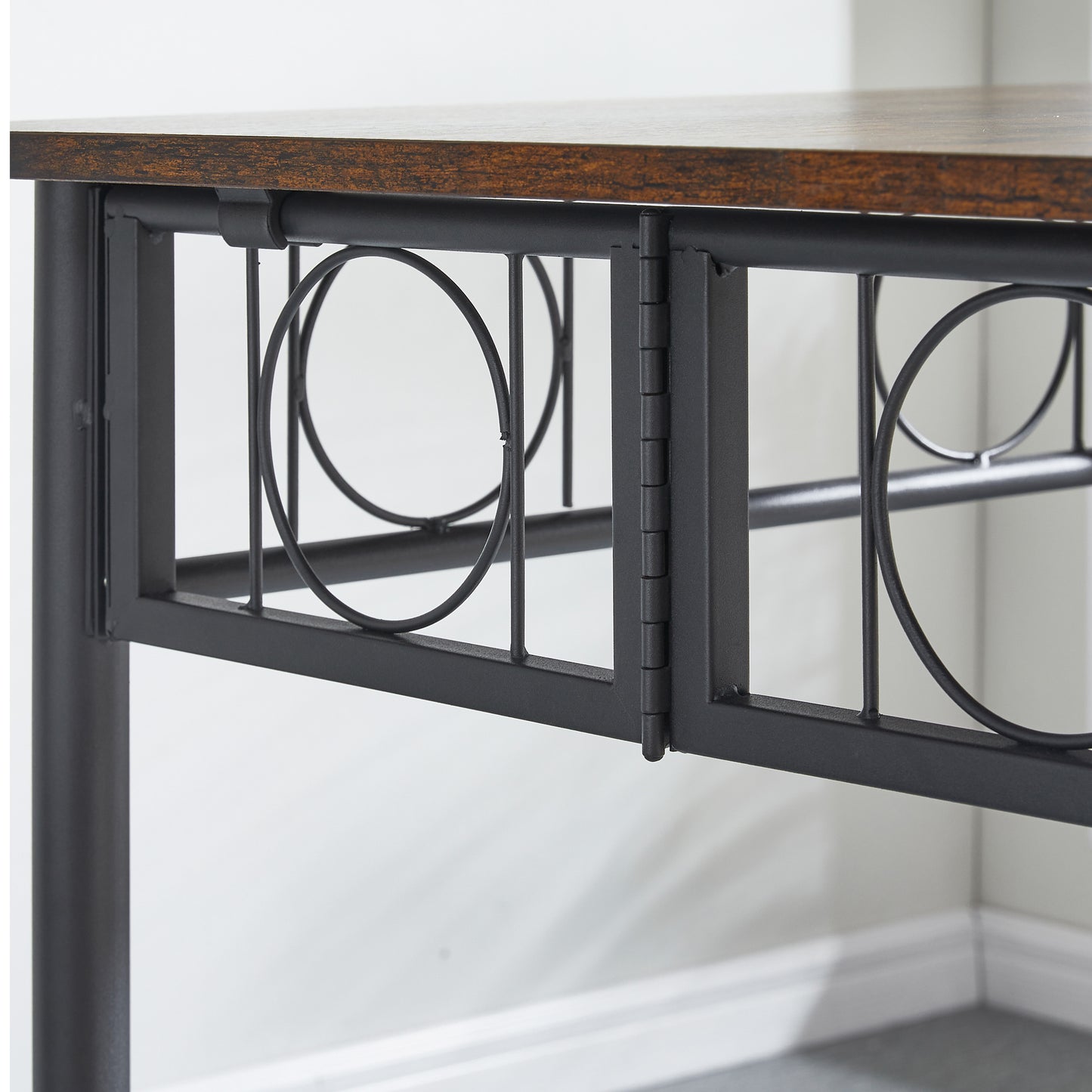 Rustic wood grain top on a black metal frame desk