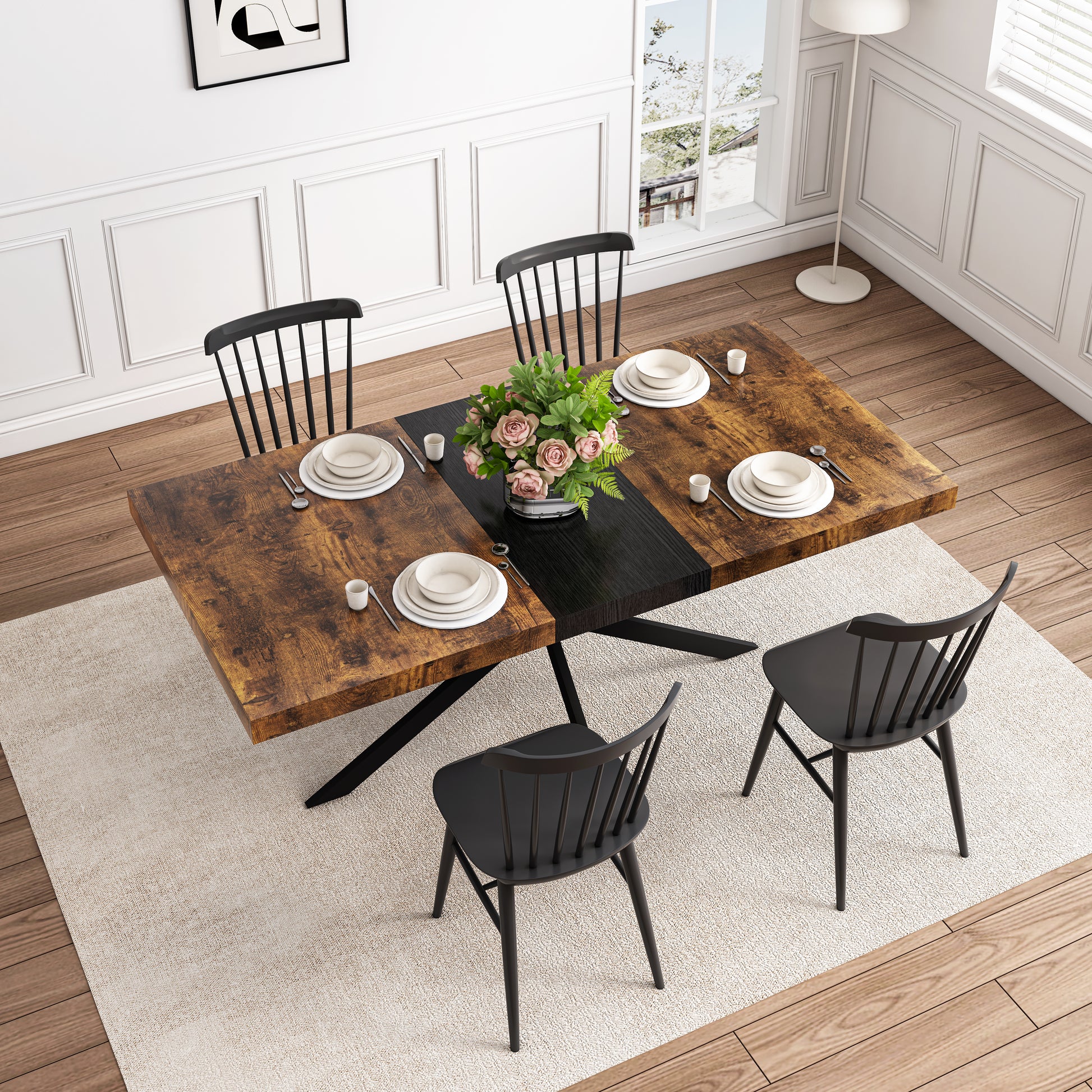 Rustic wood dining table with black metal legs and modern black chairs set for four