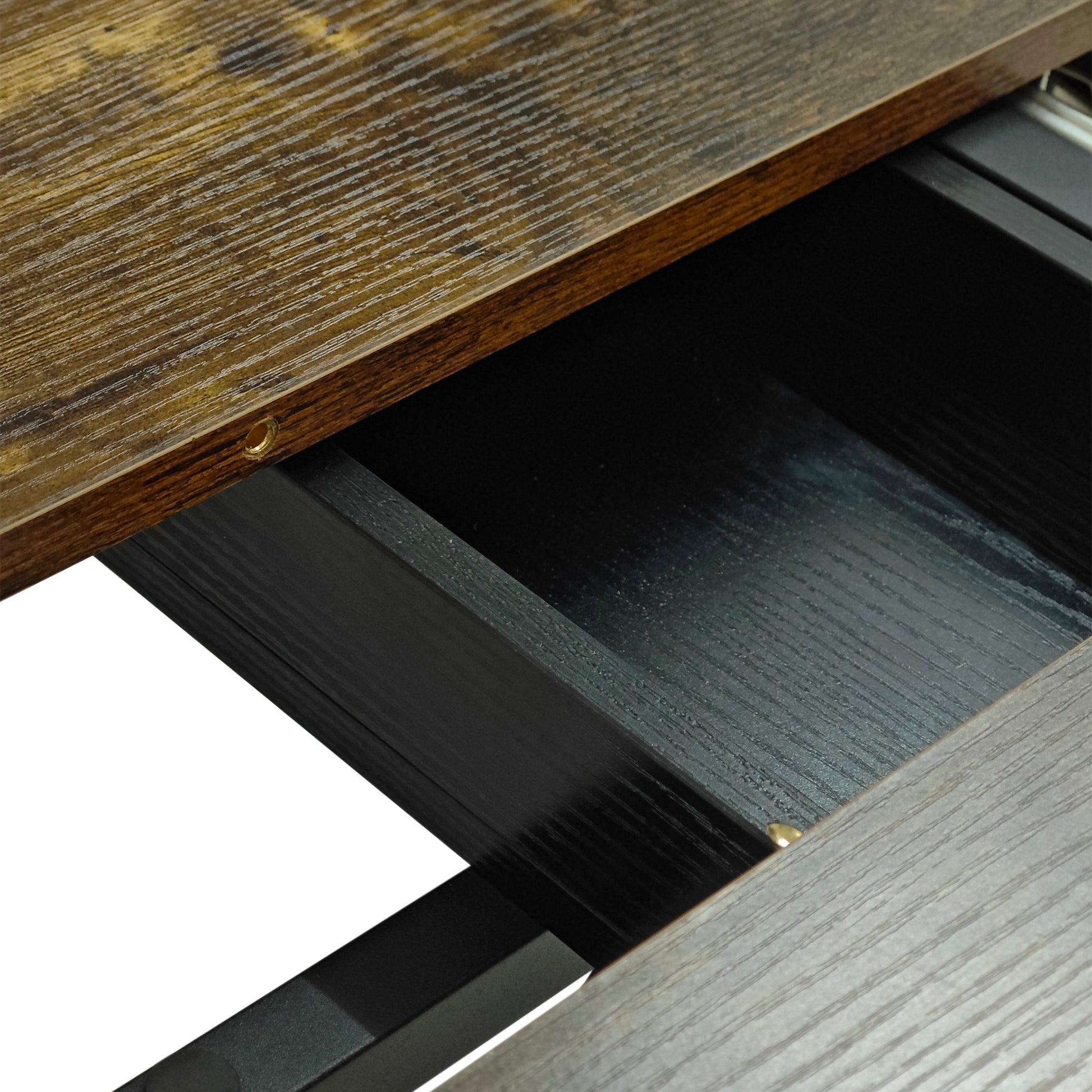 Rustic brown wood grain desk surface with black drawer interior
