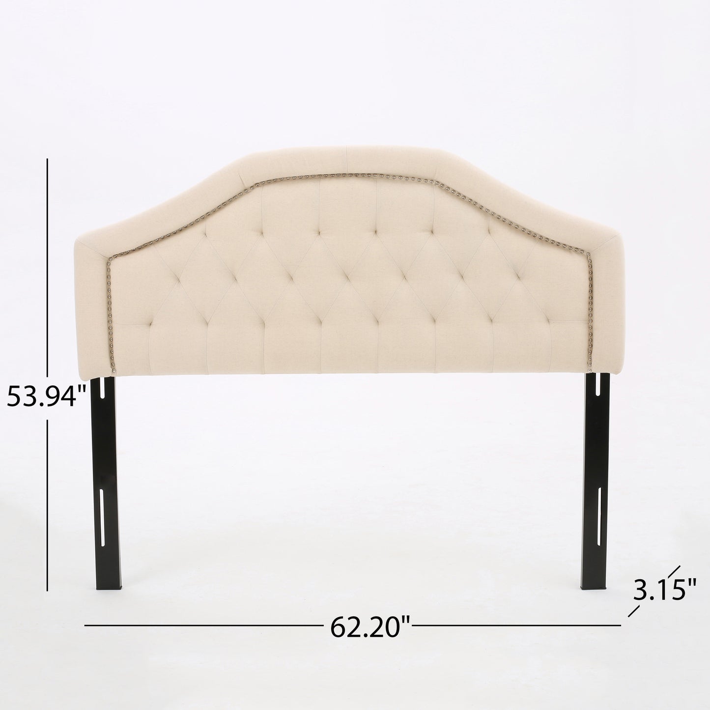 Cream upholstered headboard with diamond tufting and nailhead trim
