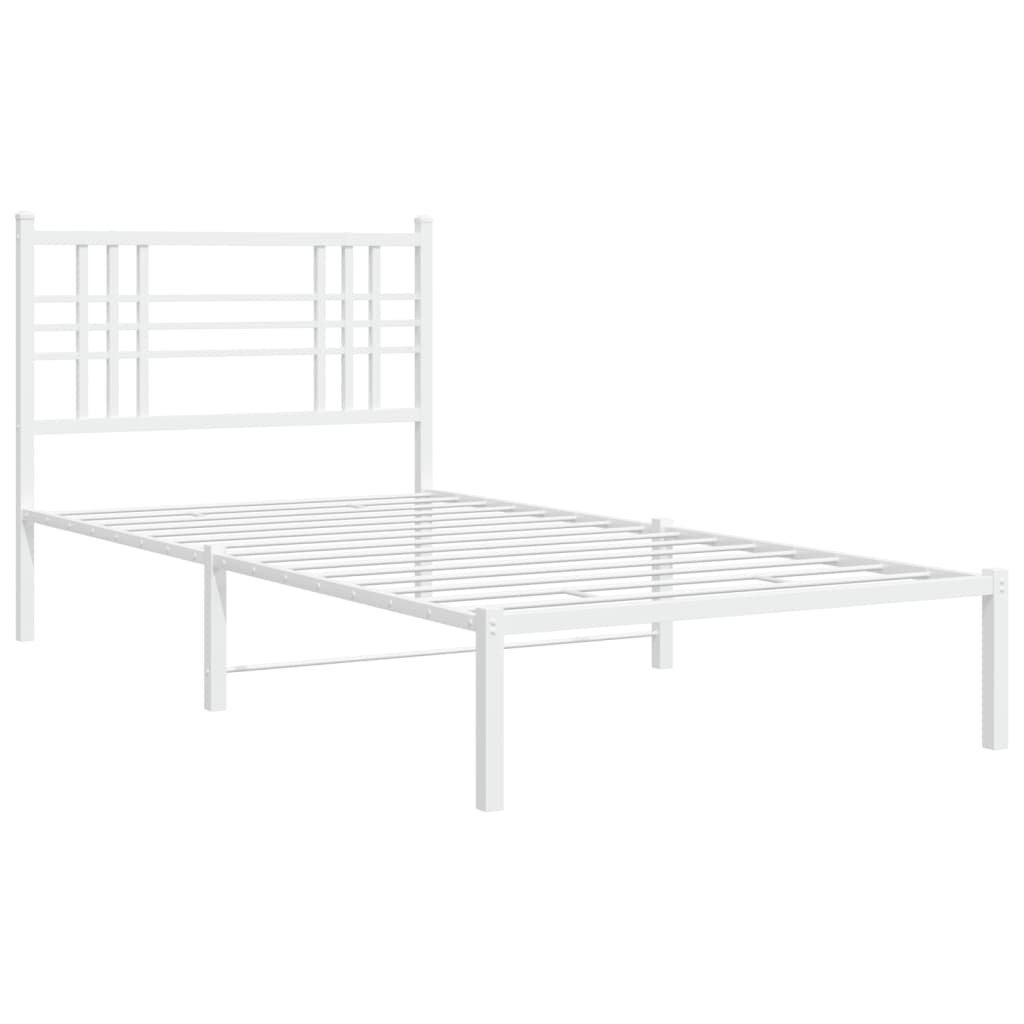 White metal bed frame with a geometric headboard and blue bedding