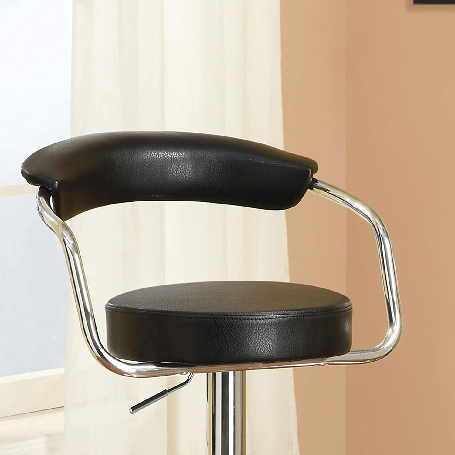 Black leather adjustable bar stool with chrome accents
