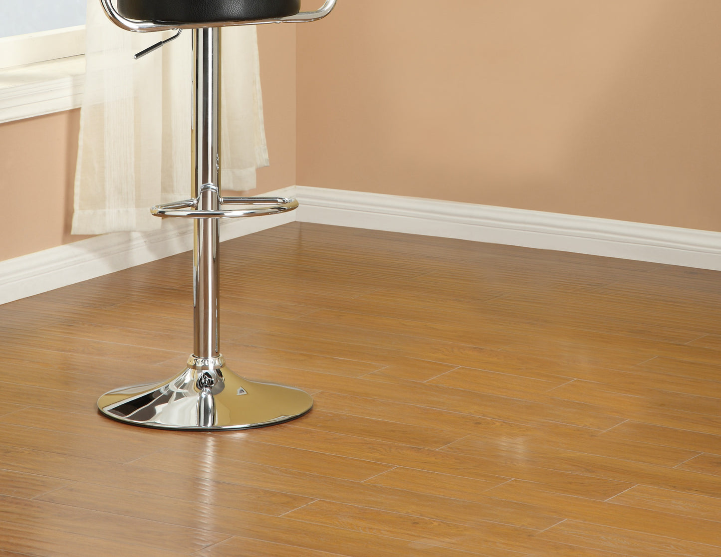 Black leather adjustable bar stool with chrome base and footrest