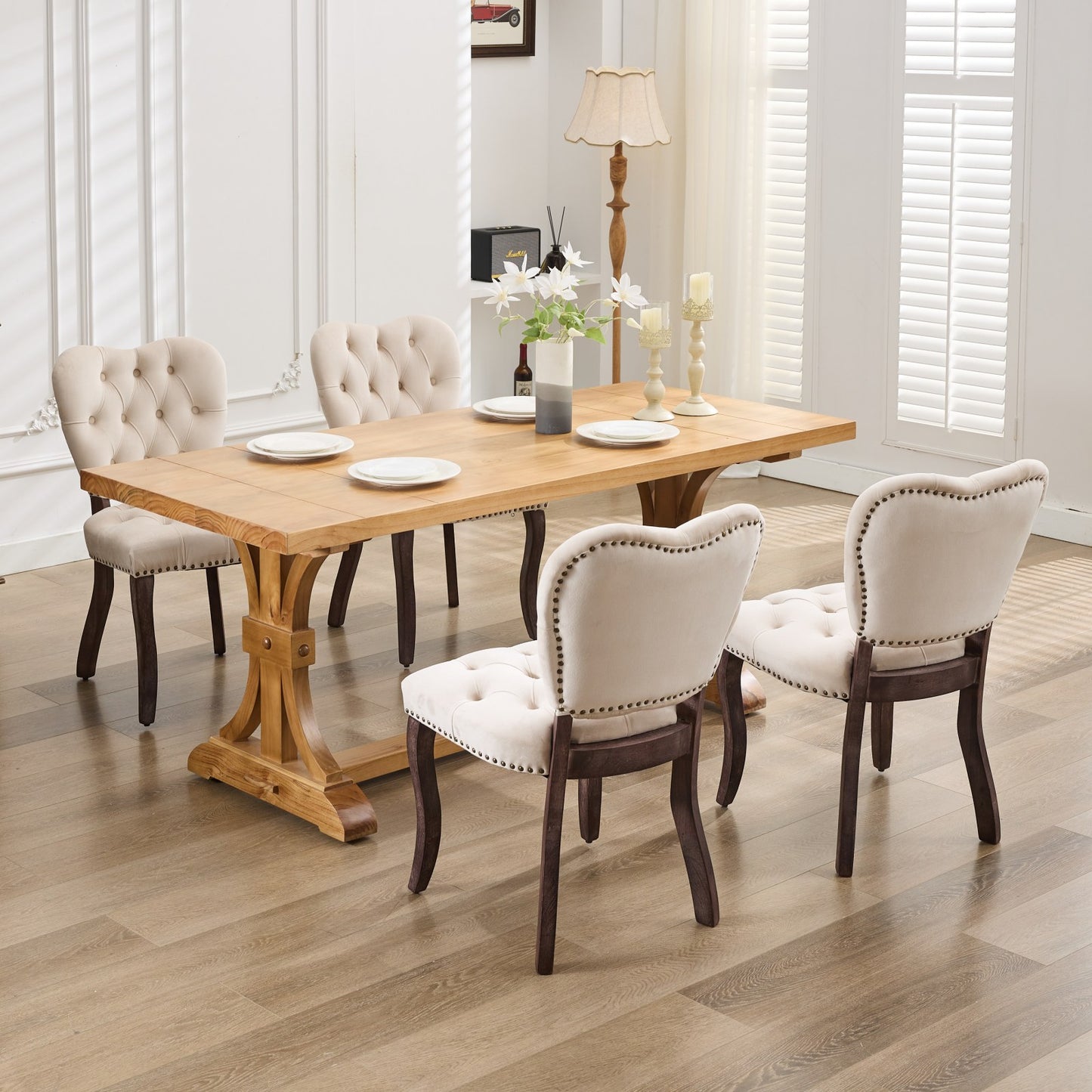 Tufted cream dining chair with nailhead trim and dark wood legs