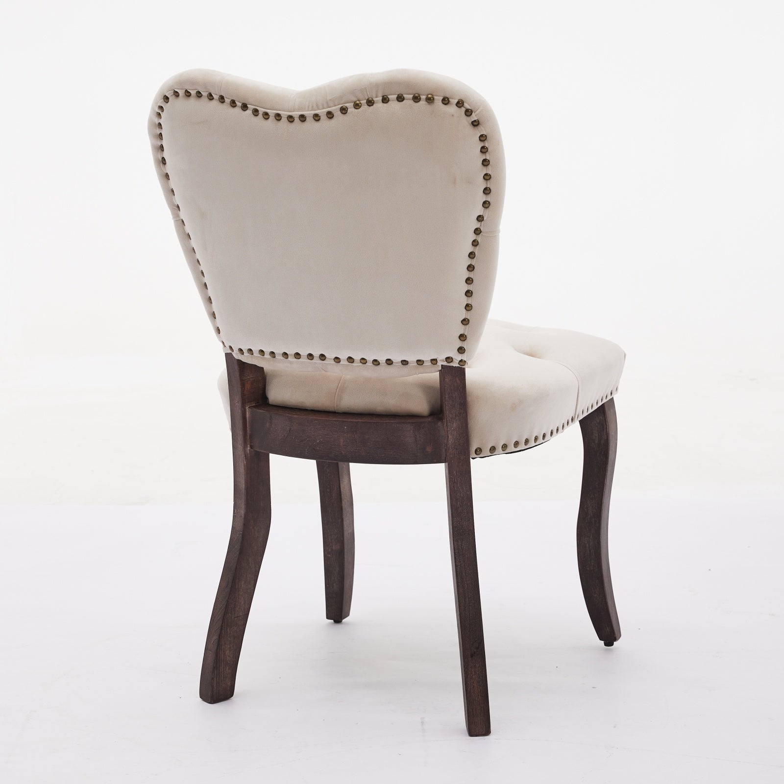 Cream velvet accent chair with brass nailhead trim