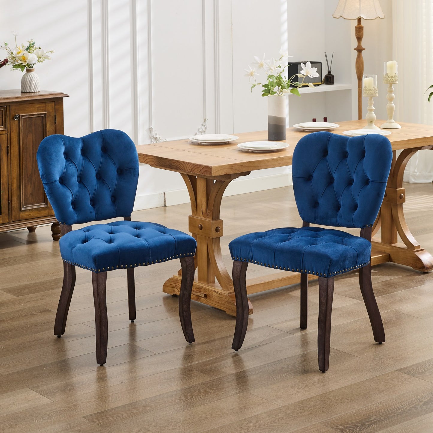 Blue velvet tufted dining chair with dark wood legs