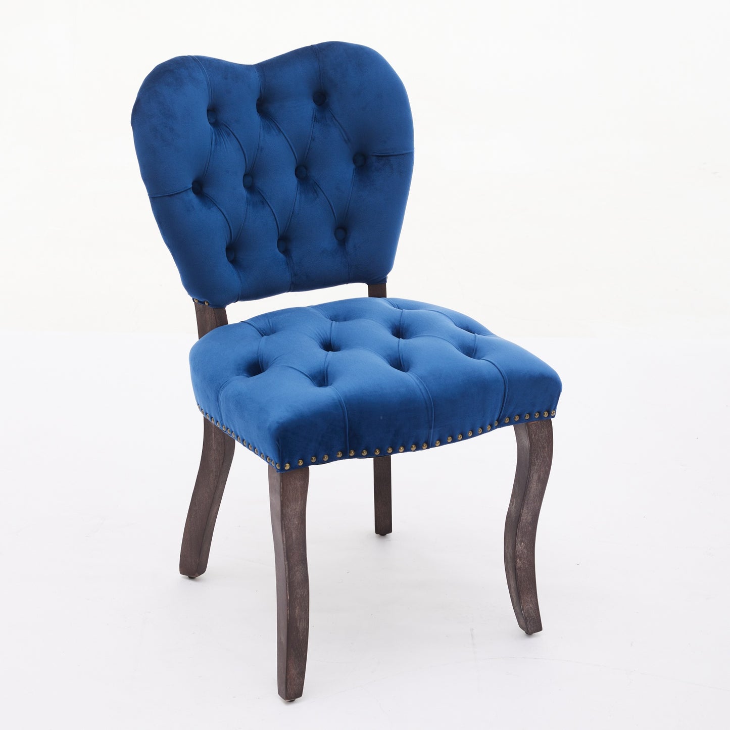 Luxurious navy blue velvet accent chair with deep button tufting