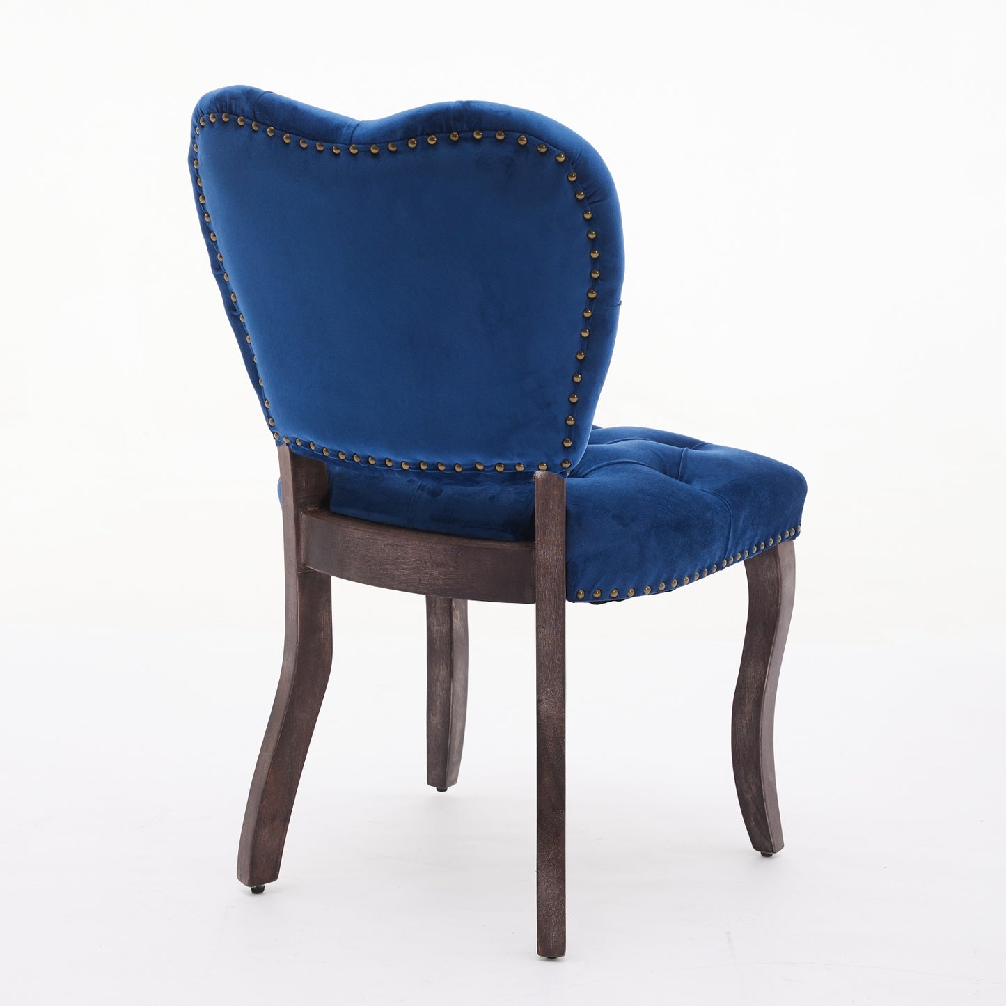 Deep blue velvet accent chair with gold nailhead trim