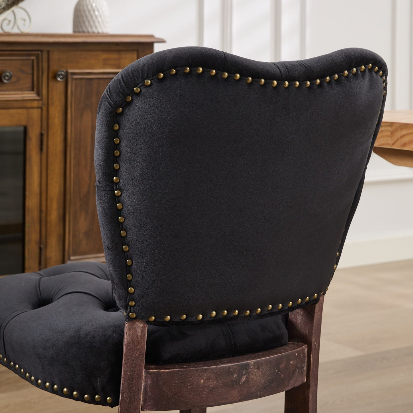 Black velvet dining chair with bronze nailhead trim