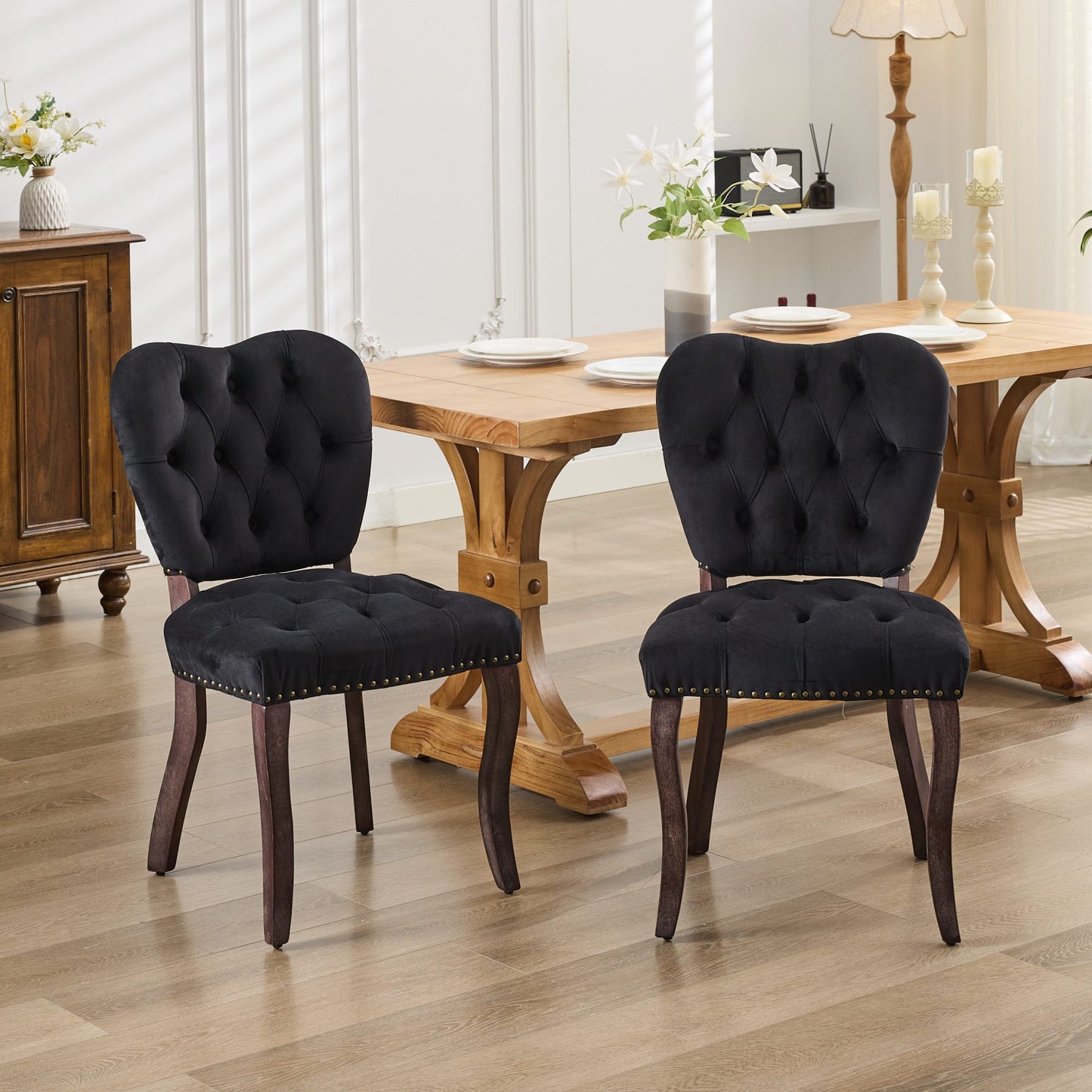 Black velvet dining chair with tufted back