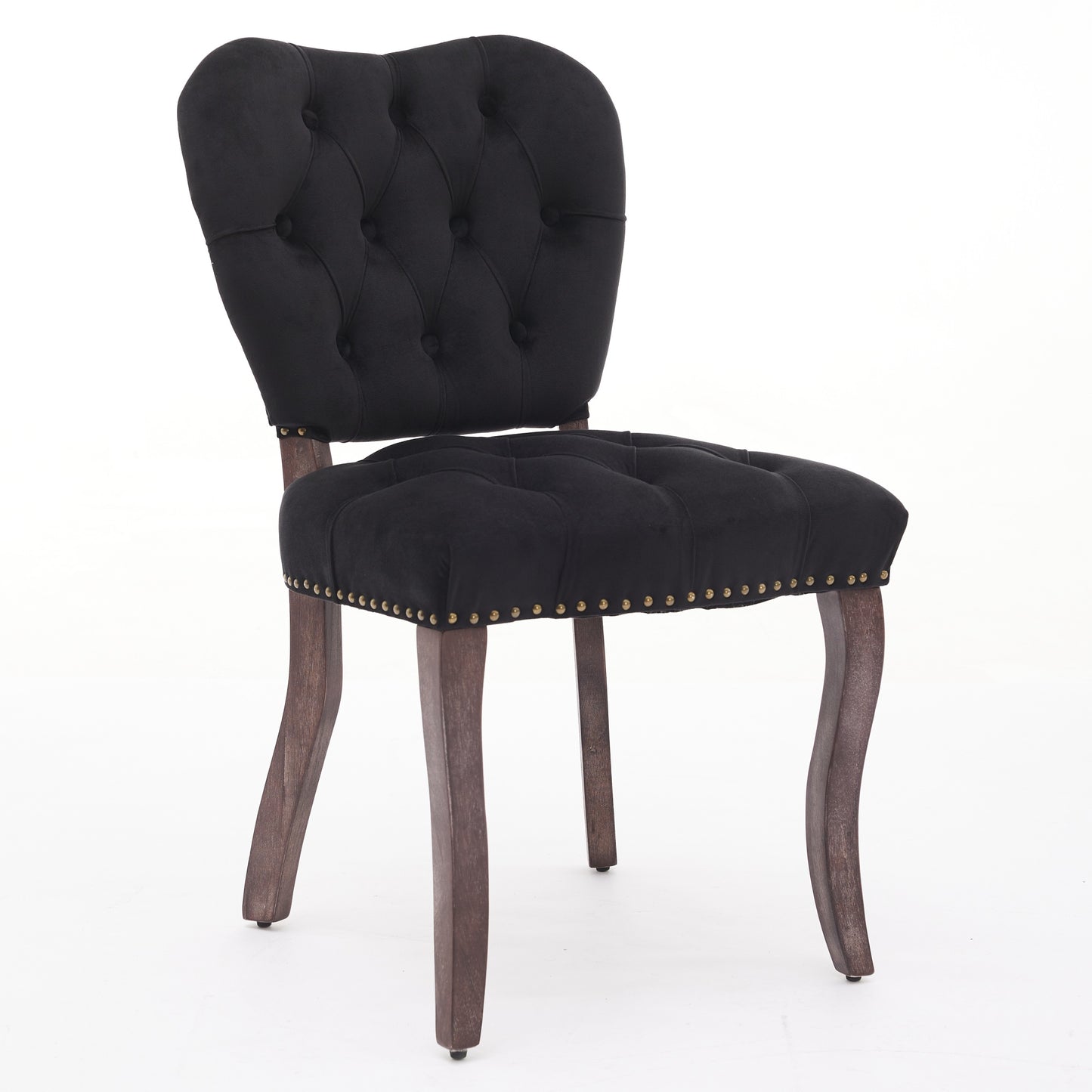 Black velvet tufted dining chair with brass nailhead trim