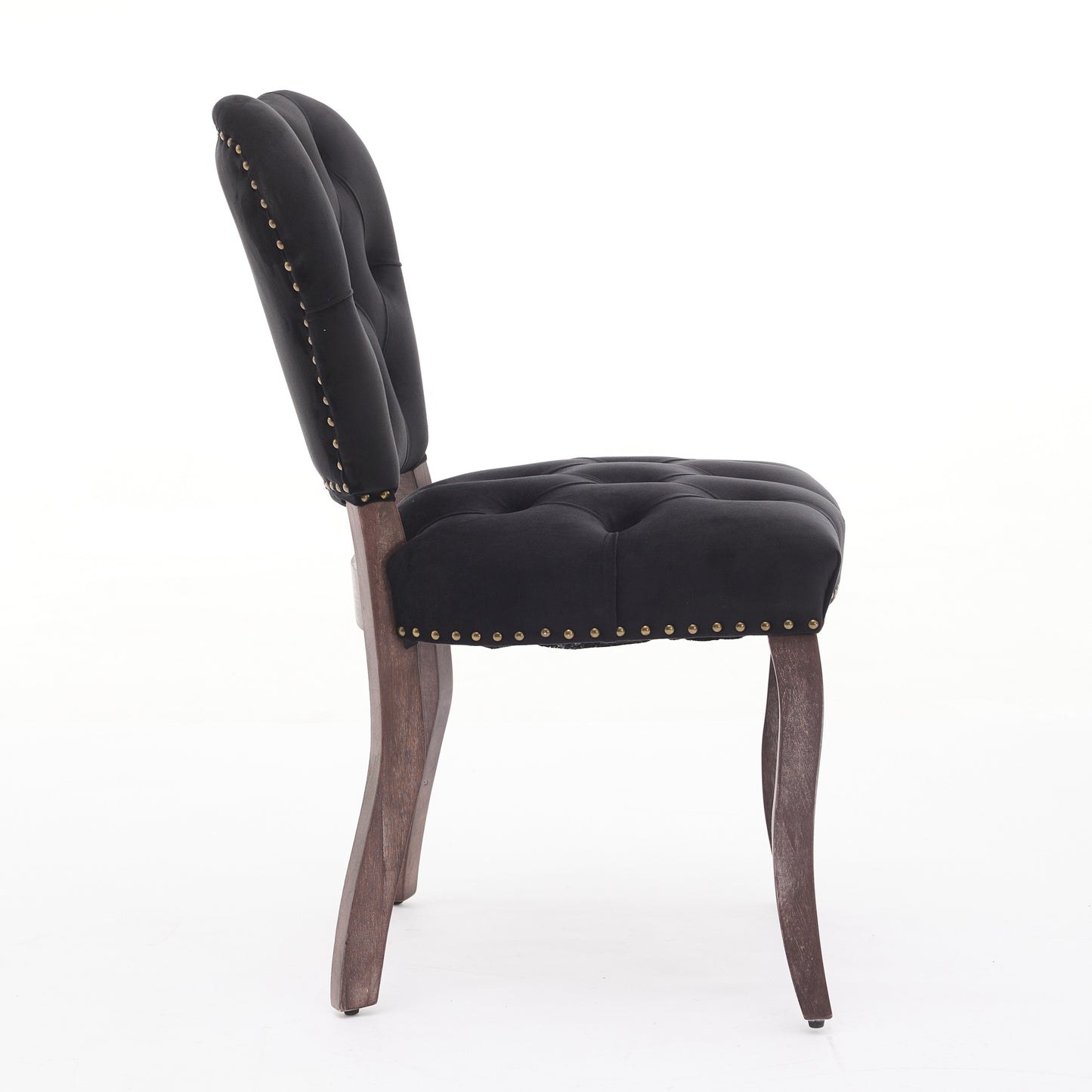 Black velvet tufted accent chair with gold nailhead trim