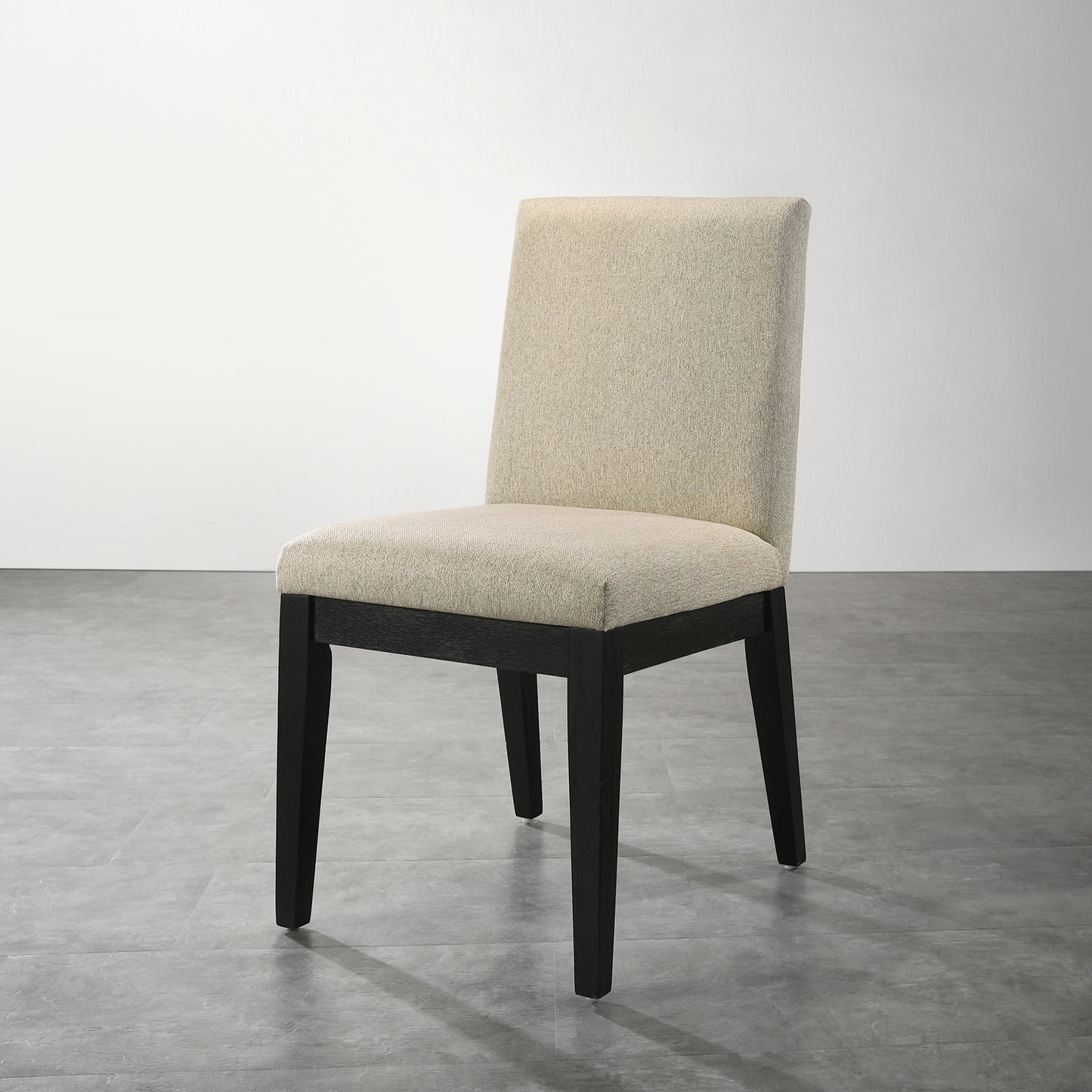 Cream upholstered dining chair with dark wood legs