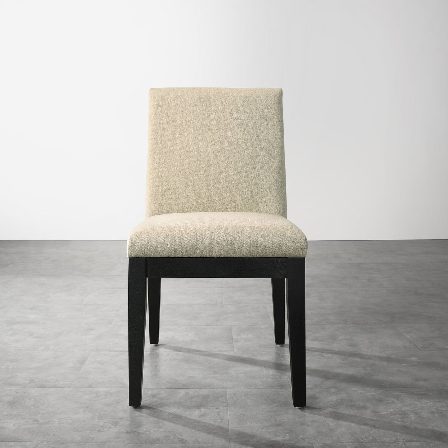 Beige upholstered dining chair with dark wood legs