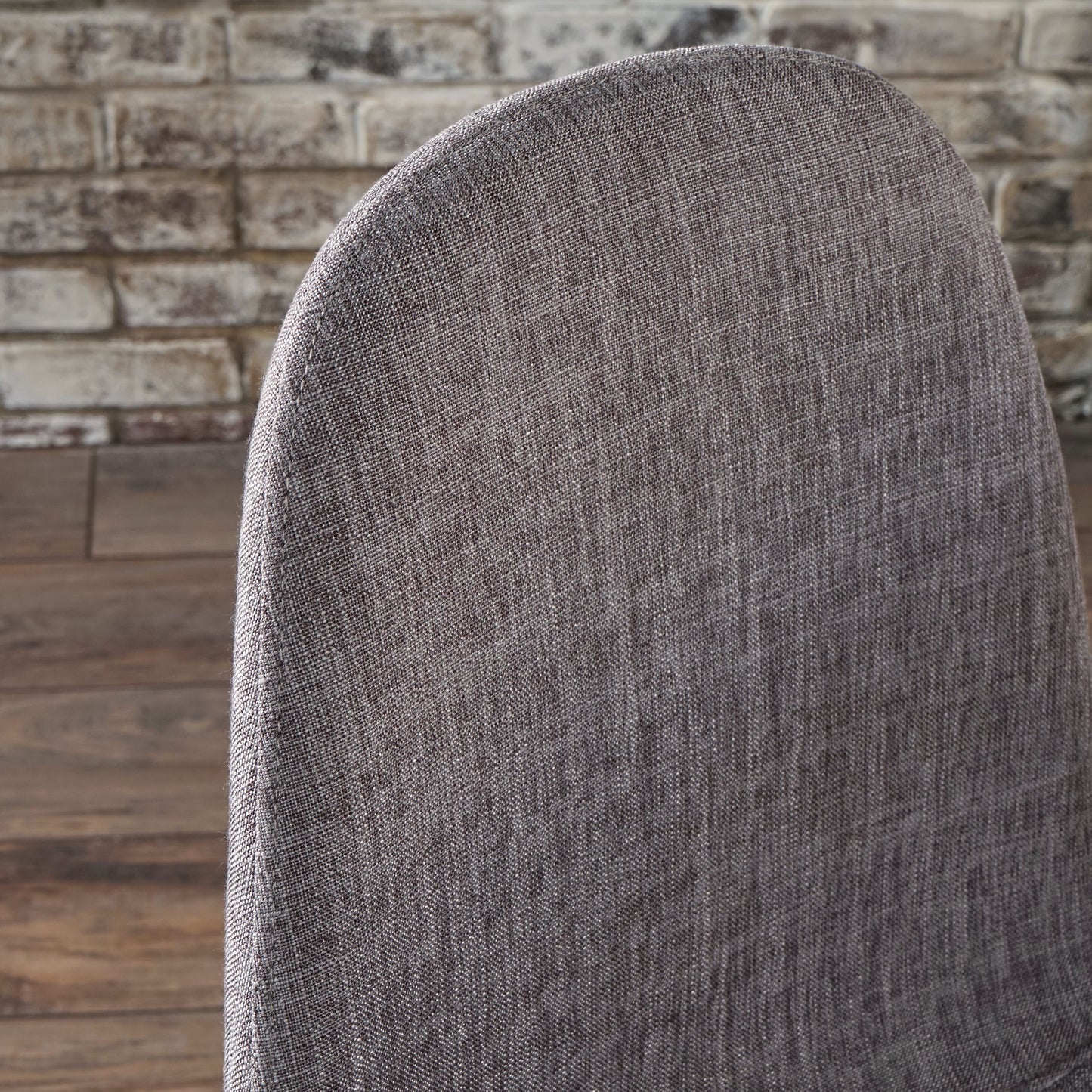 Charcoal grey textured fabric chair back with visible weave