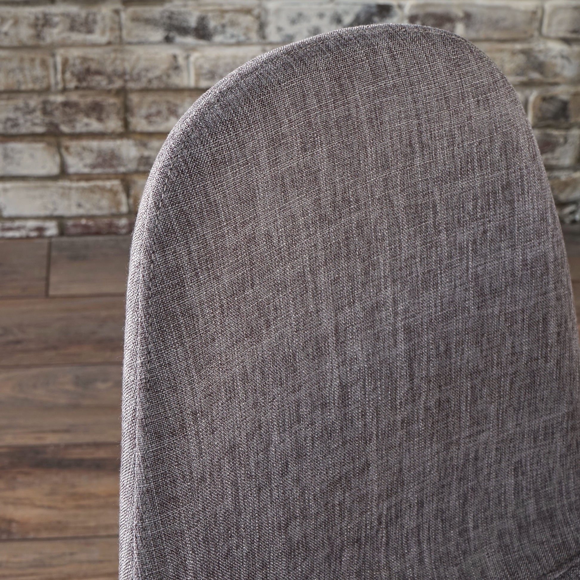 Charcoal grey textured fabric chair back with visible weave