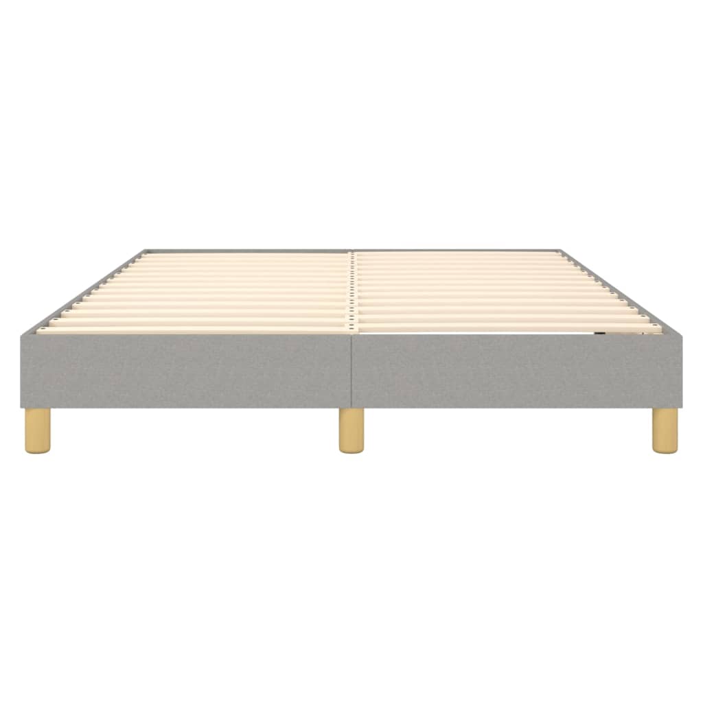 Grey upholstered platform bed frame with wooden slats and gold legs