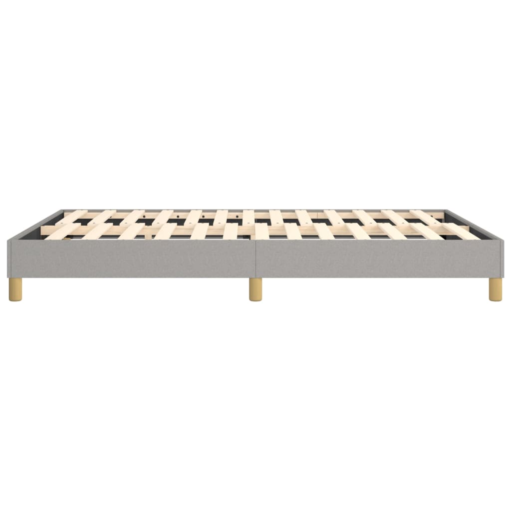Grey upholstered platform bed frame with wooden slats and gold legs