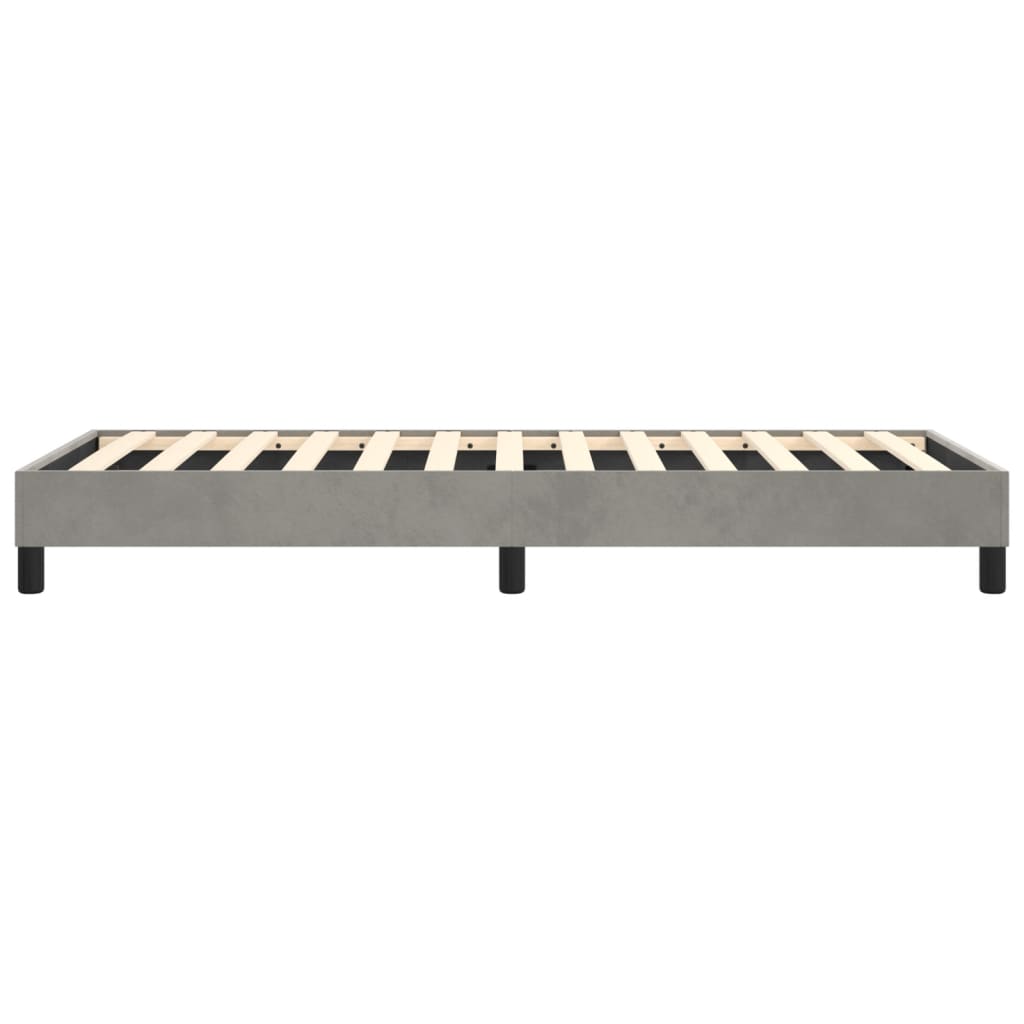 Gray upholstered platform bed frame with wooden slats