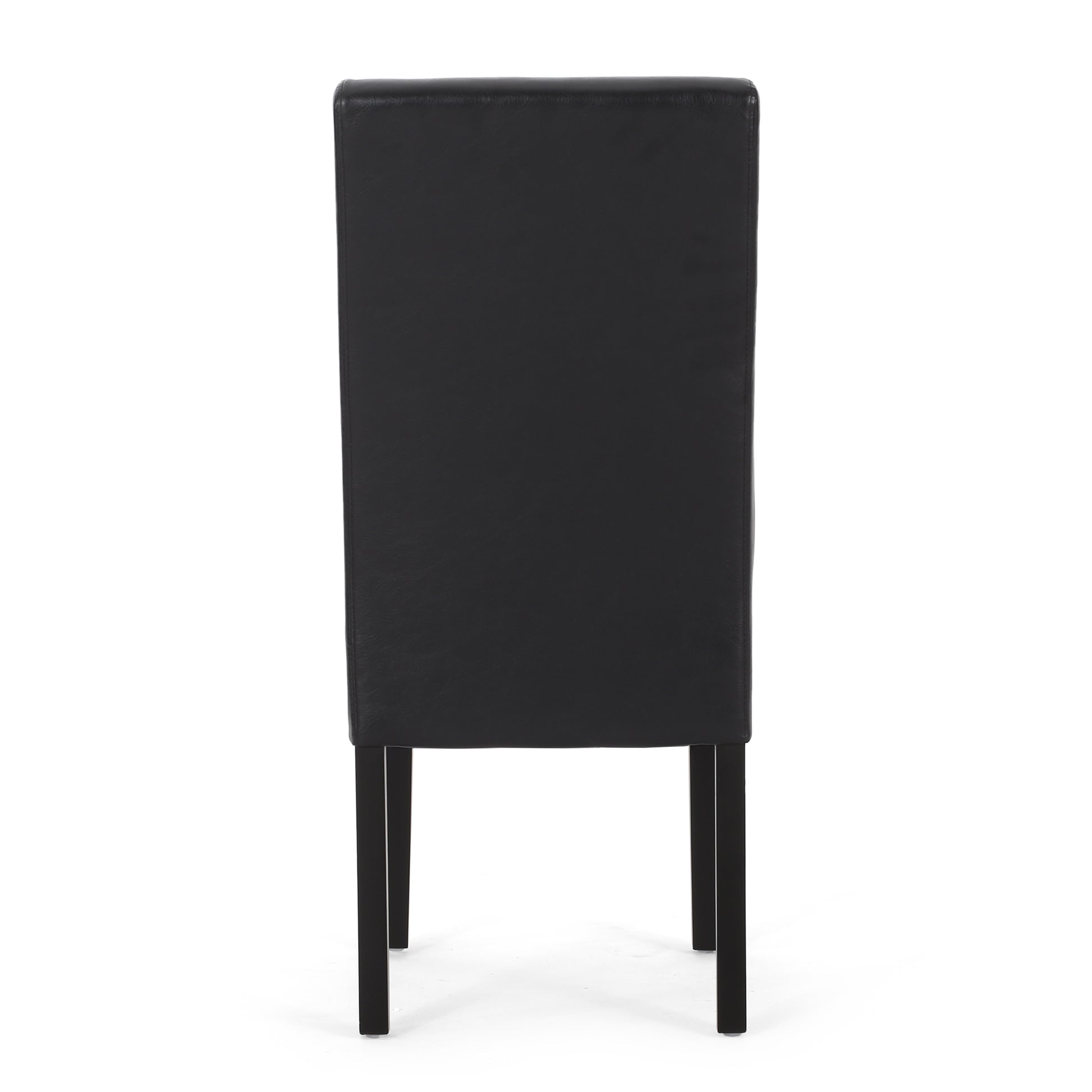 Back view of a black leather dining chair with dark wooden legs