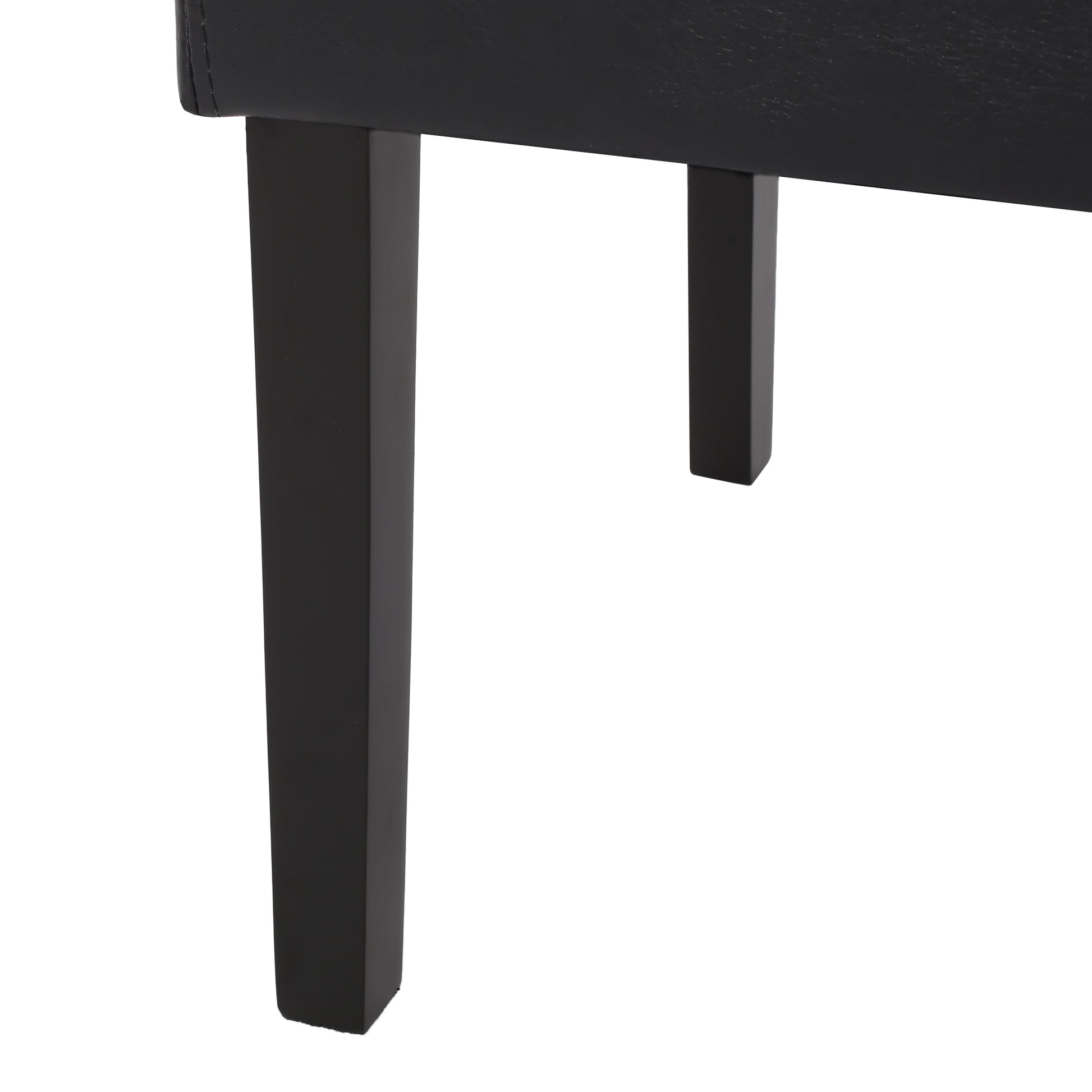 Black faux leather armchair legs detail