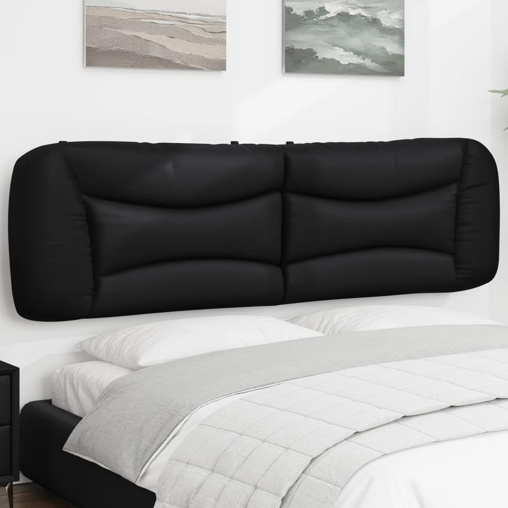 Black upholstered headboard with tufted paneling for a modern bedroom