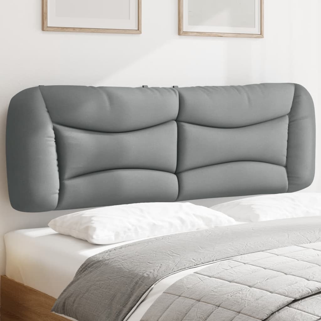 Gray upholstered headboard with curved panel design