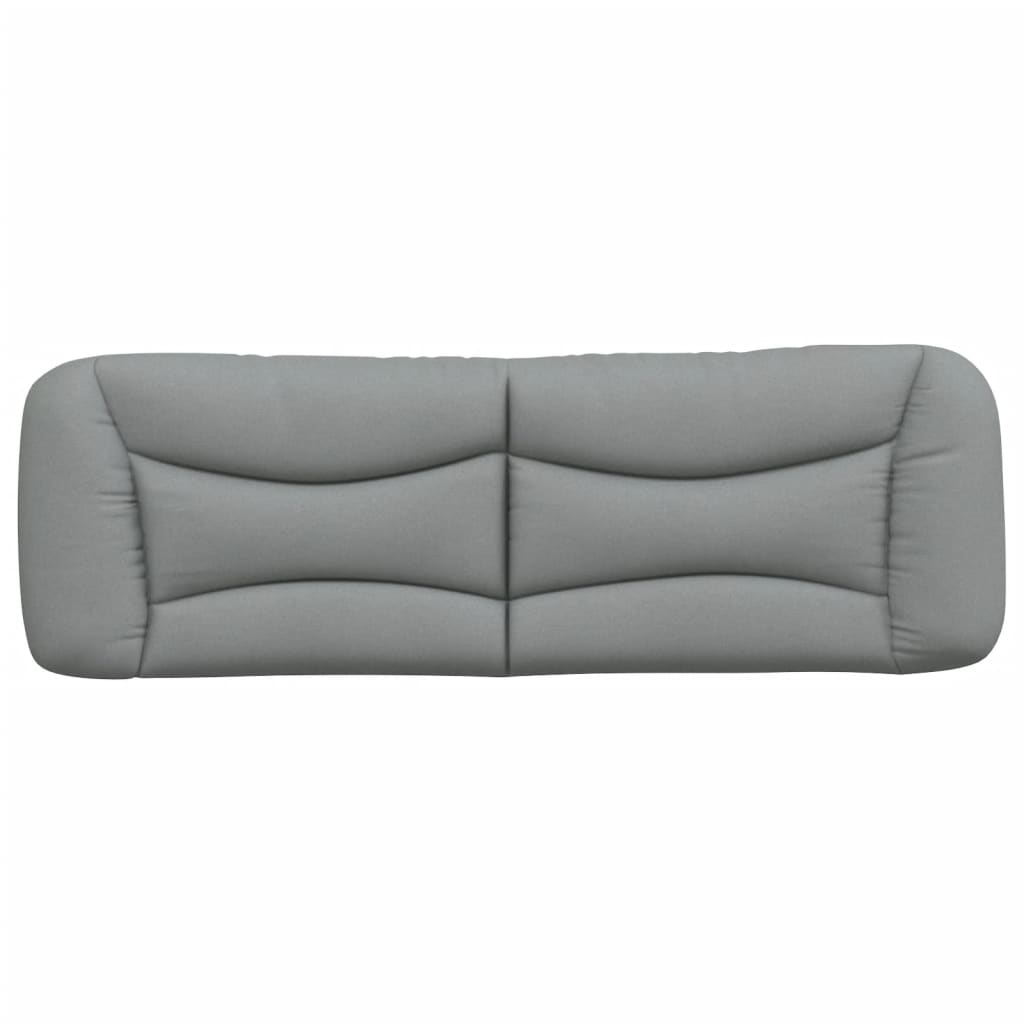 Grey upholstered headboard with segmented design on a bed