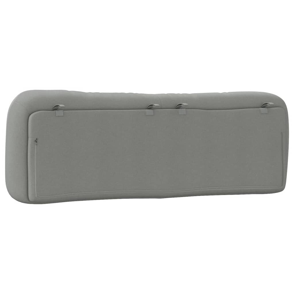 Tufted grey fabric headboard with a modern curved design