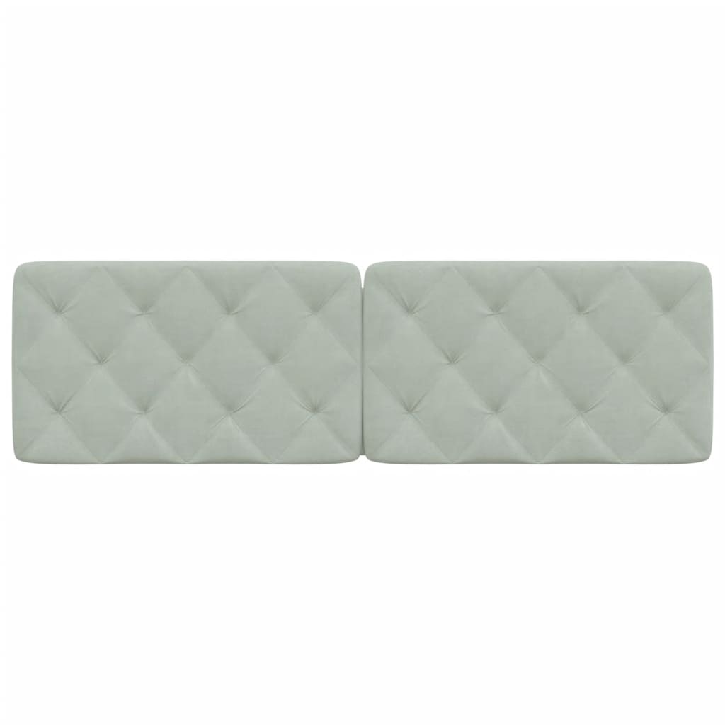 Light grey upholstered headboard with diamond tufting