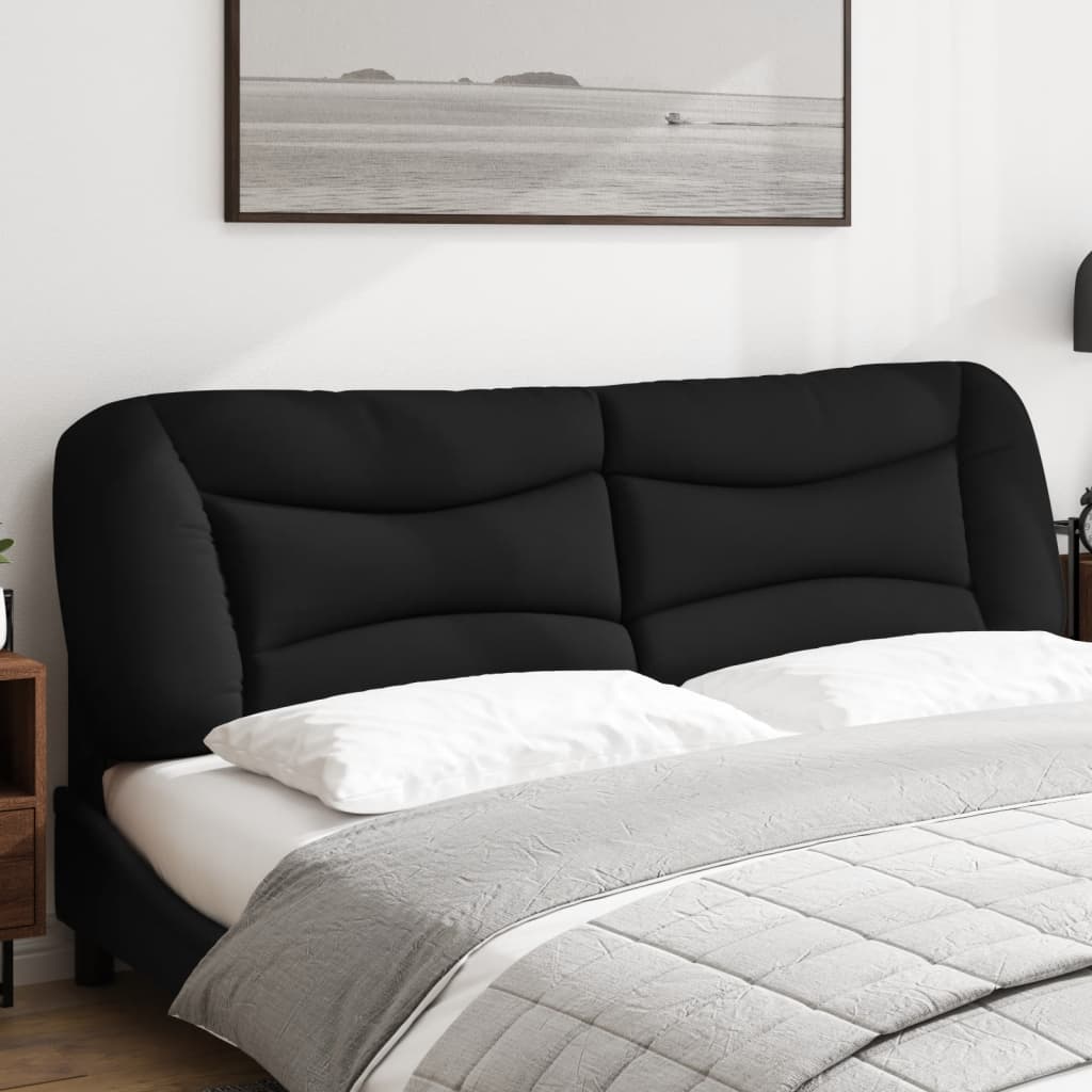Black upholstered headboard with tufted panels