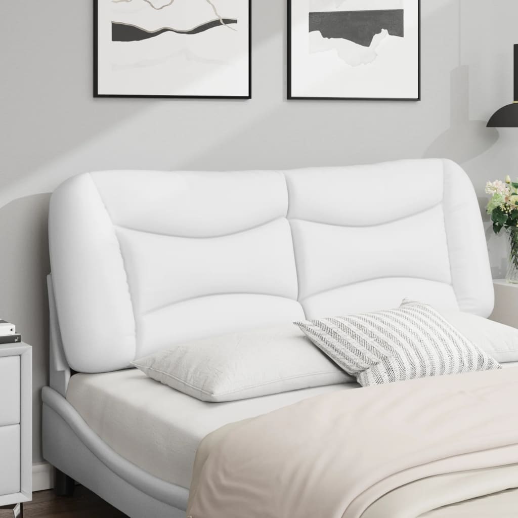 White upholstered tufted headboard mounted on a grey wall above a bed