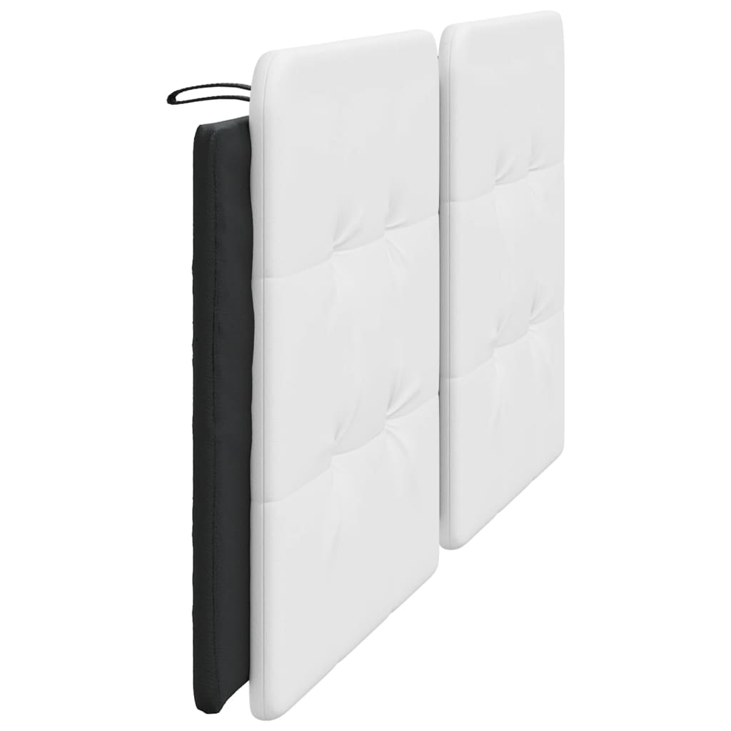 White upholstered headboard sections with button tufting
