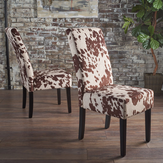 Brown and white cow print dining chair with dark wood legs